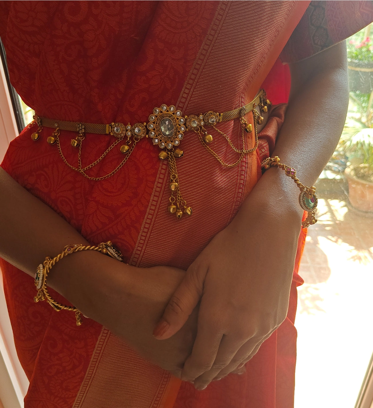 Belt with red/clear stone in centre and hangings all around
