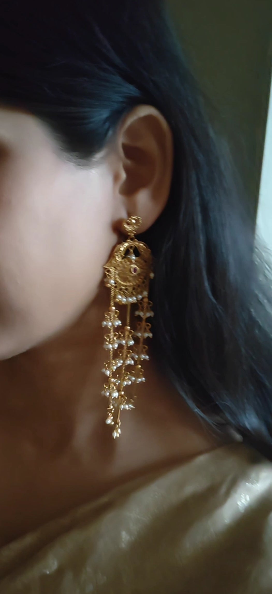 Gold earrings with pearls clusters hanging on three chains