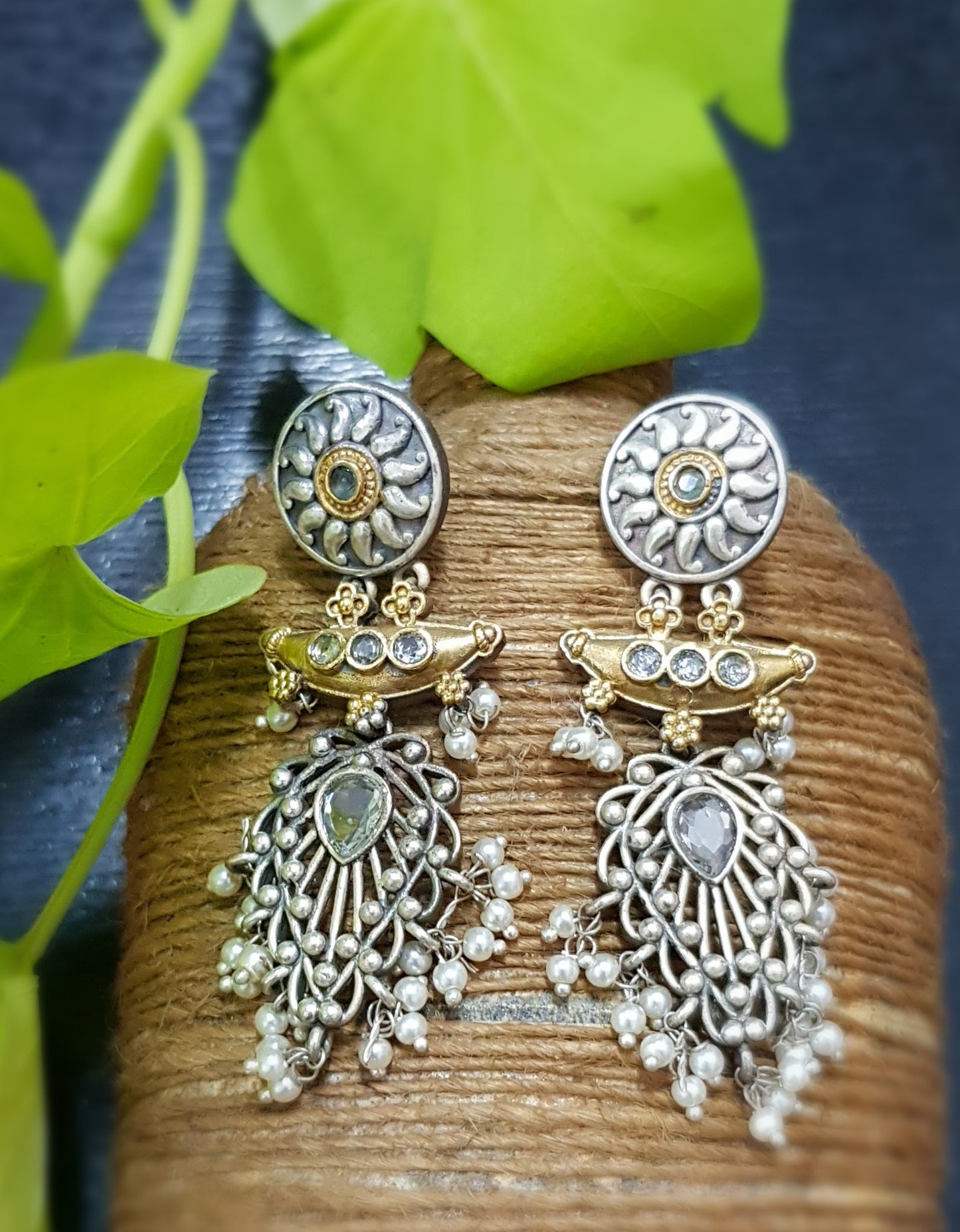 Earrings in dual tone with neutral coloured stone and pearls