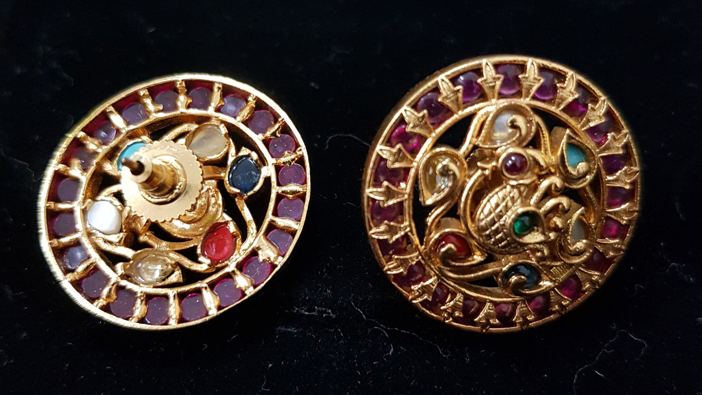 Beautiful round temple jewelry studs (earrings) inlaid with kemp stones and navratan