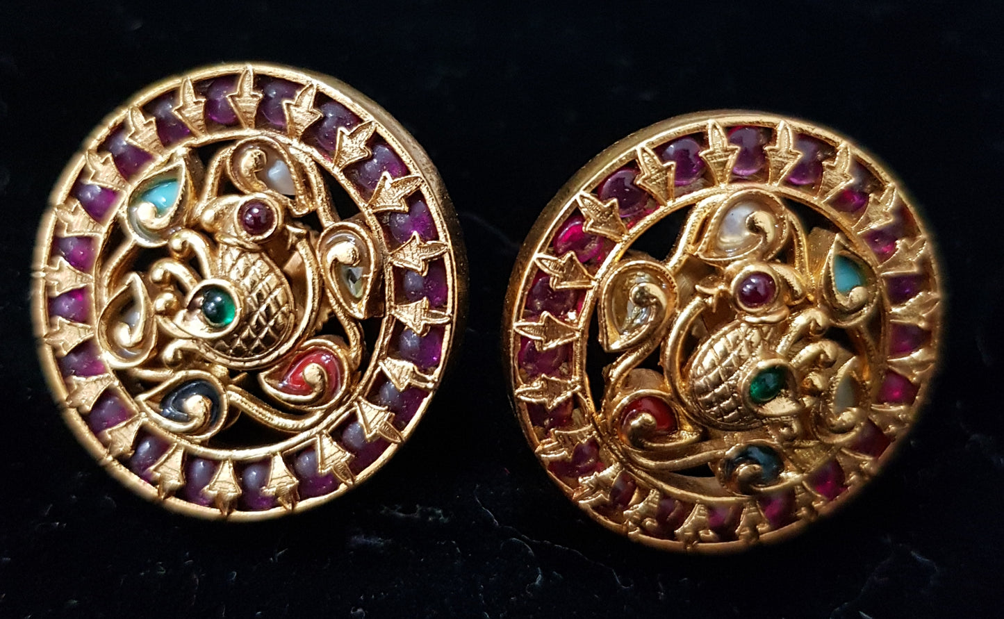 Beautiful round temple jewelry studs (earrings) inlaid with kemp stones and navratan