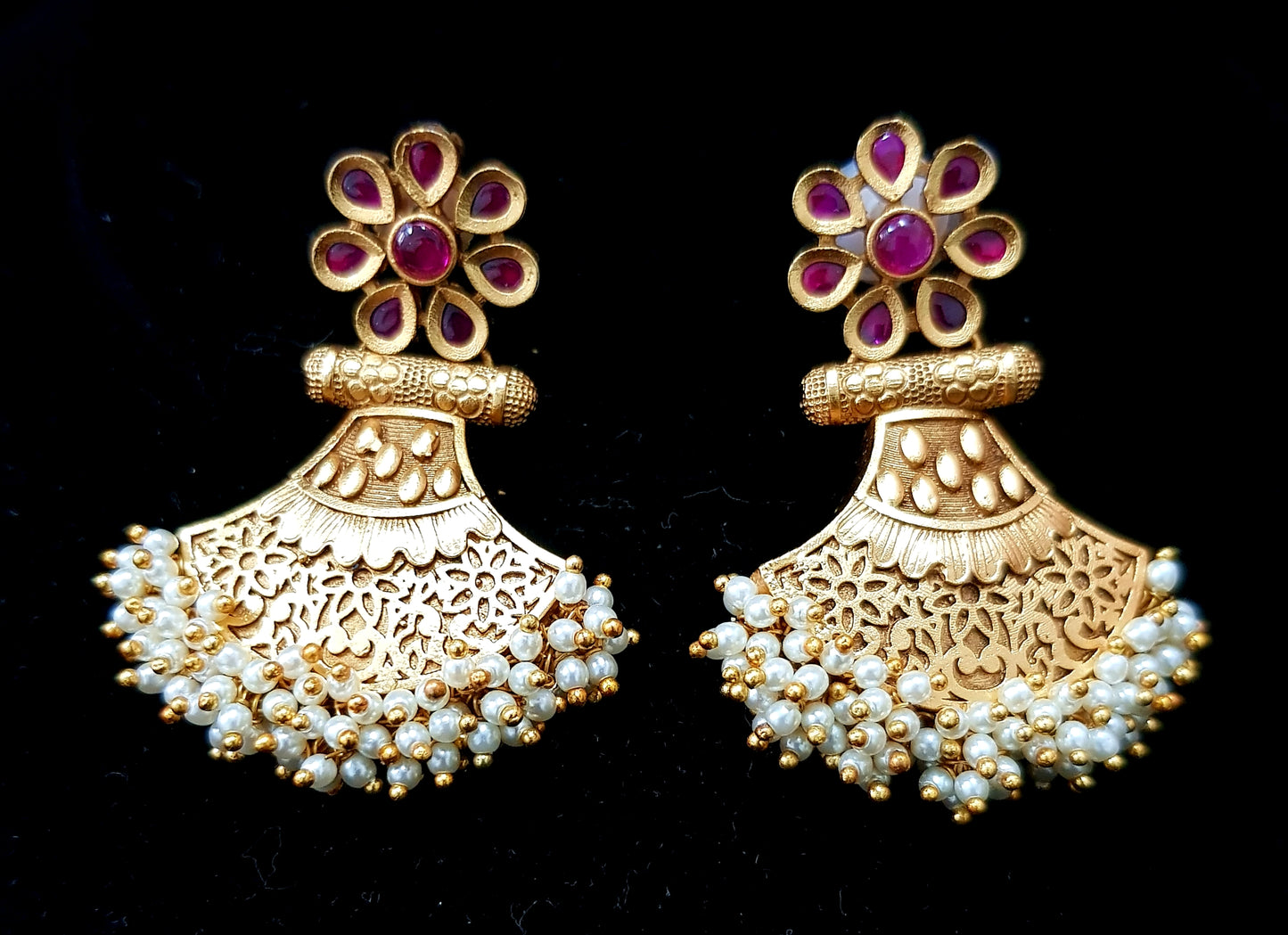 Unique gold finish earrings with kemp stones and pearl clusters