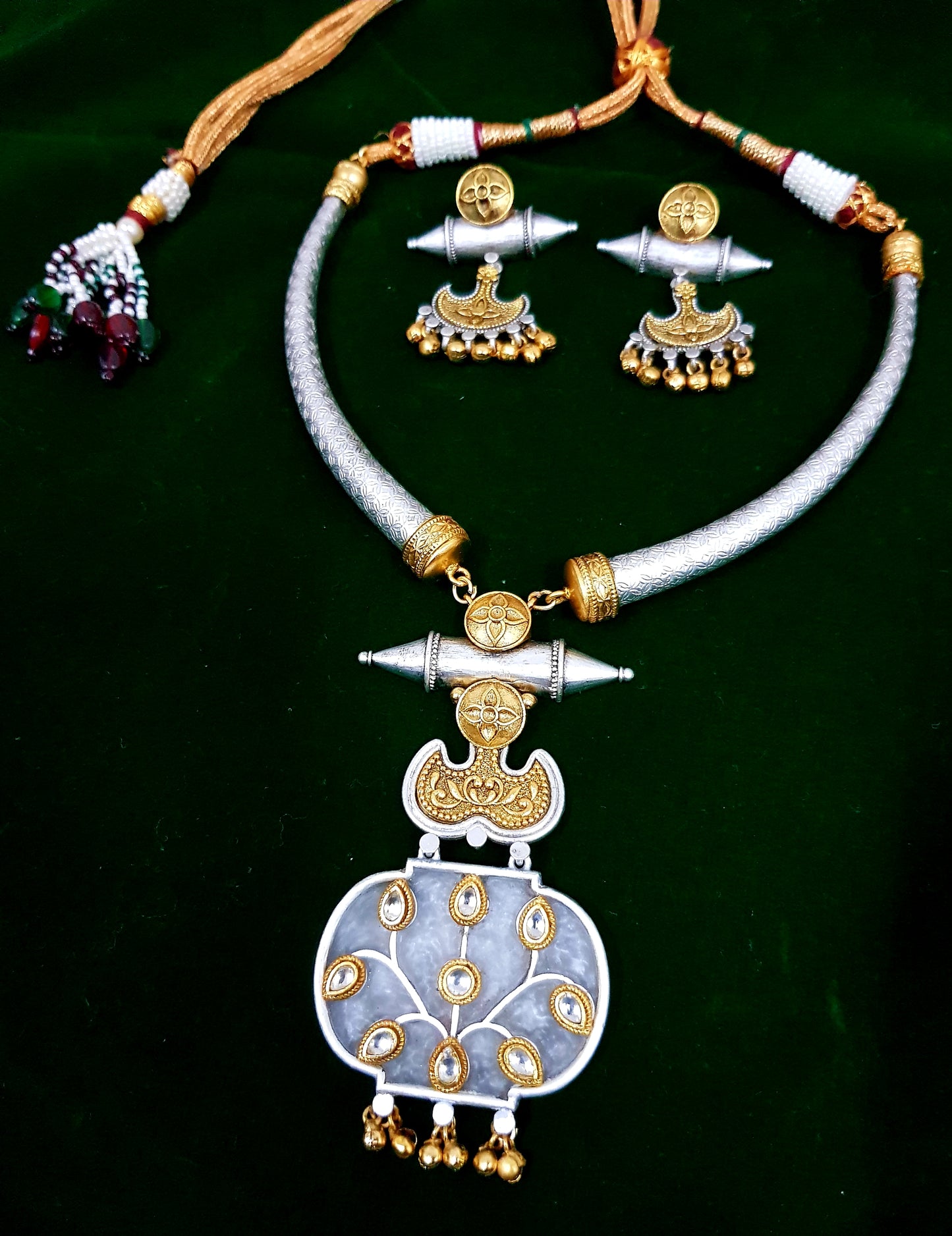 Hasli set with golden silver finish, pendant with work and tribal earrings