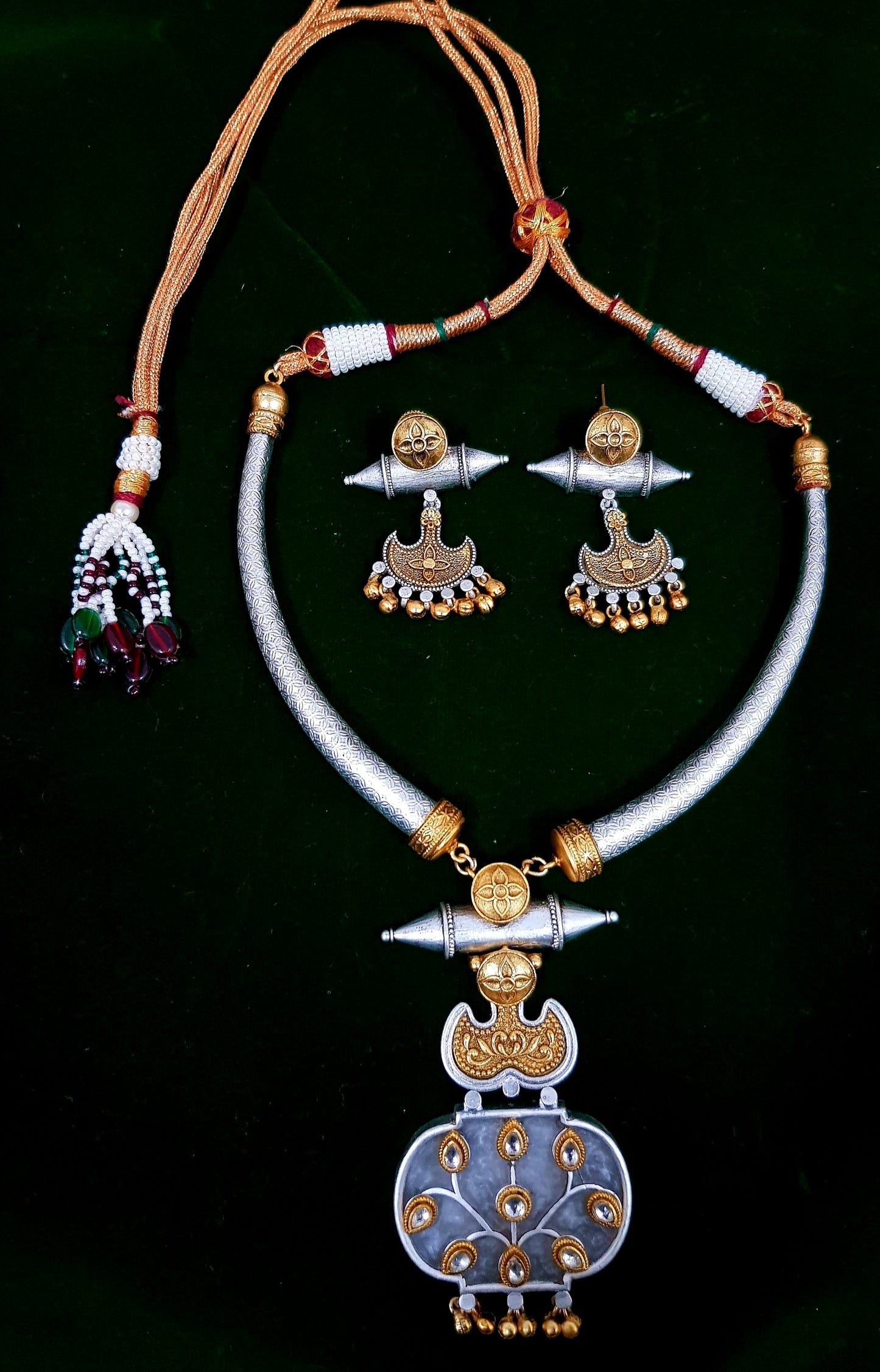 Hasli set with golden silver finish, pendant with work and tribal earrings