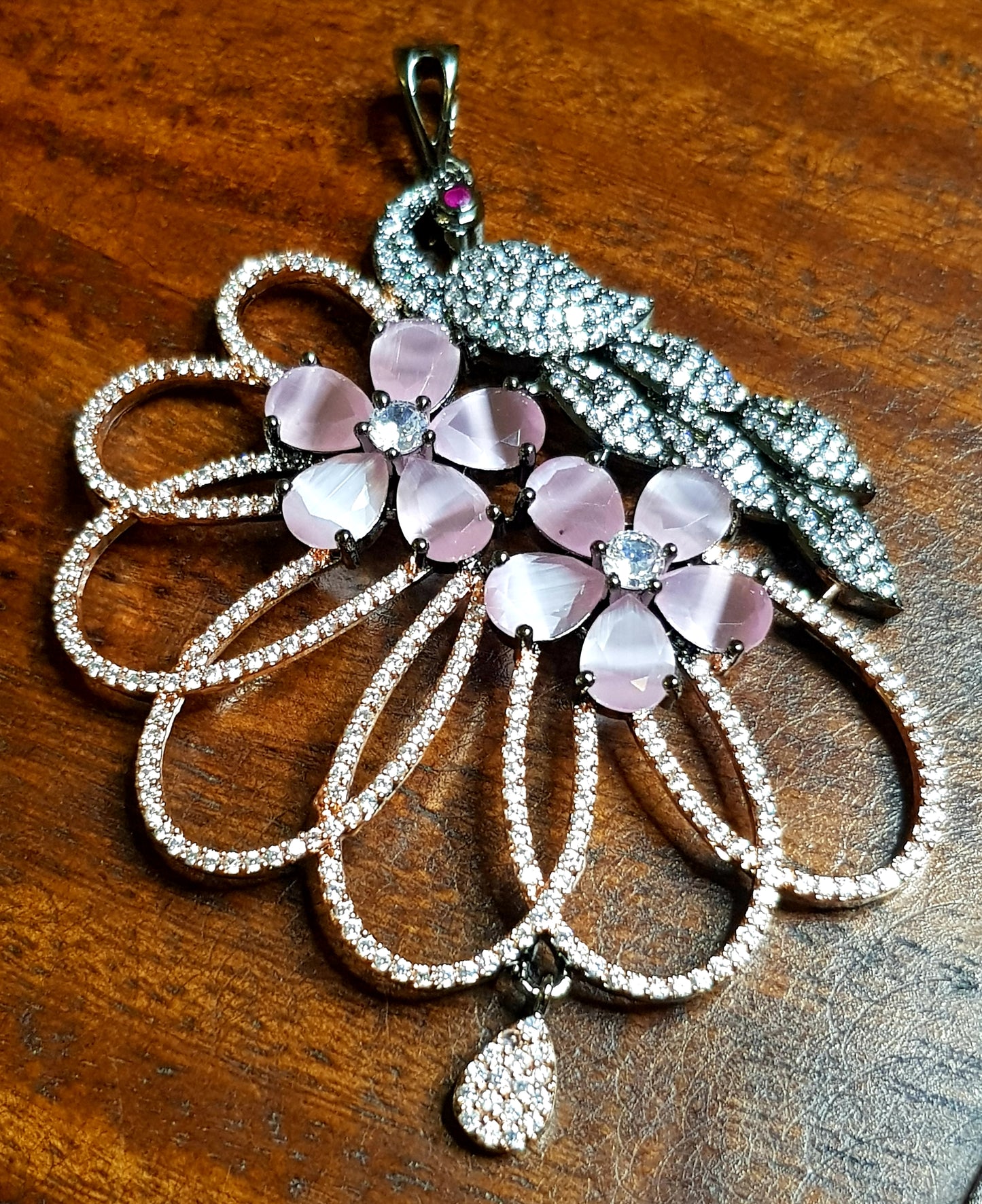 Pink peacock motif pendant and earrings