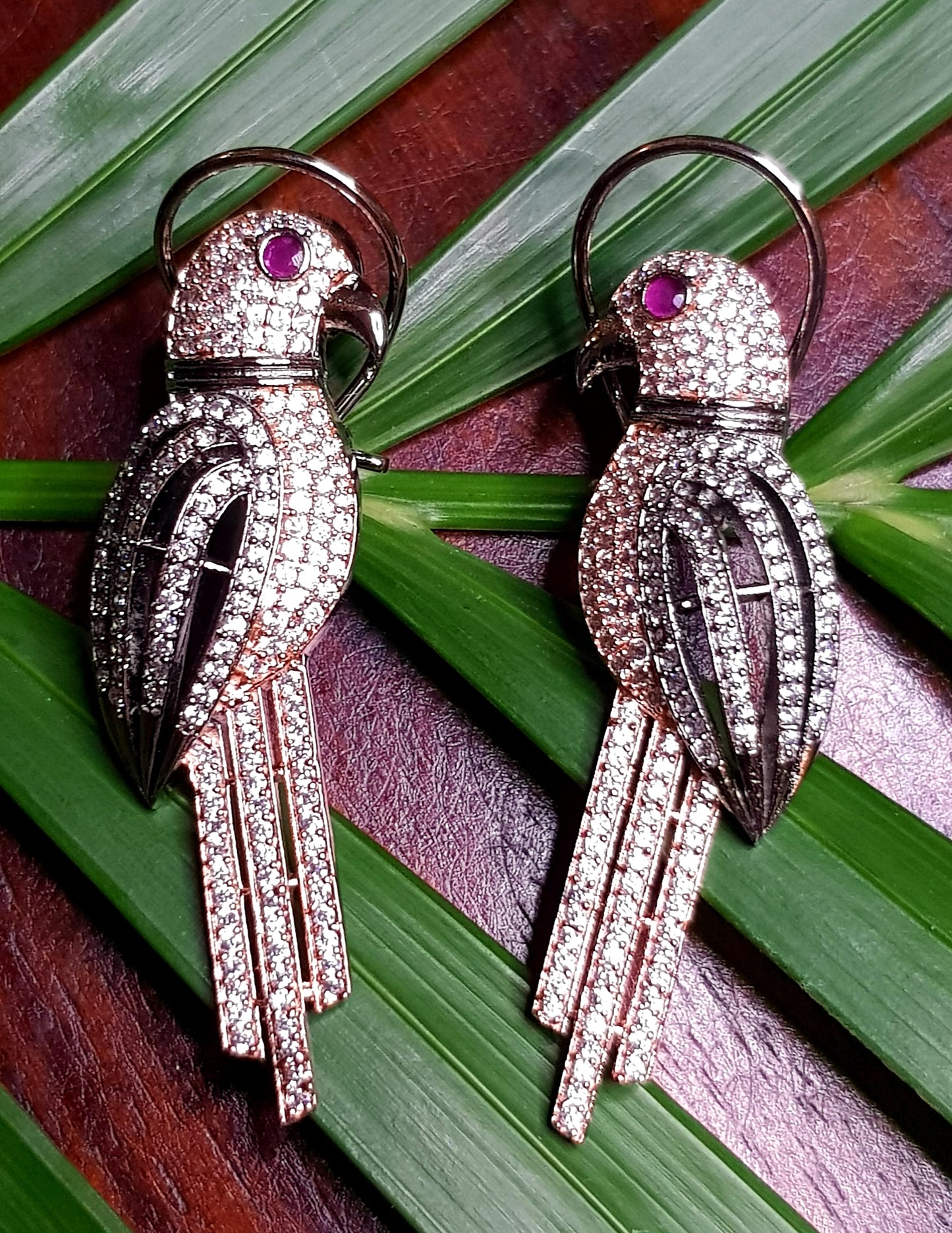 Antique finish, Parrot motif earrings with rose gold and rhodium/full rhodium finish,red stone