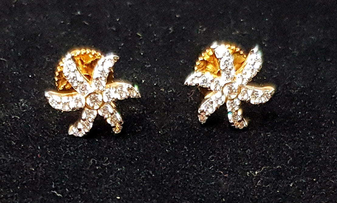 Sleek gold finish set with CZ and starfish shaped studs