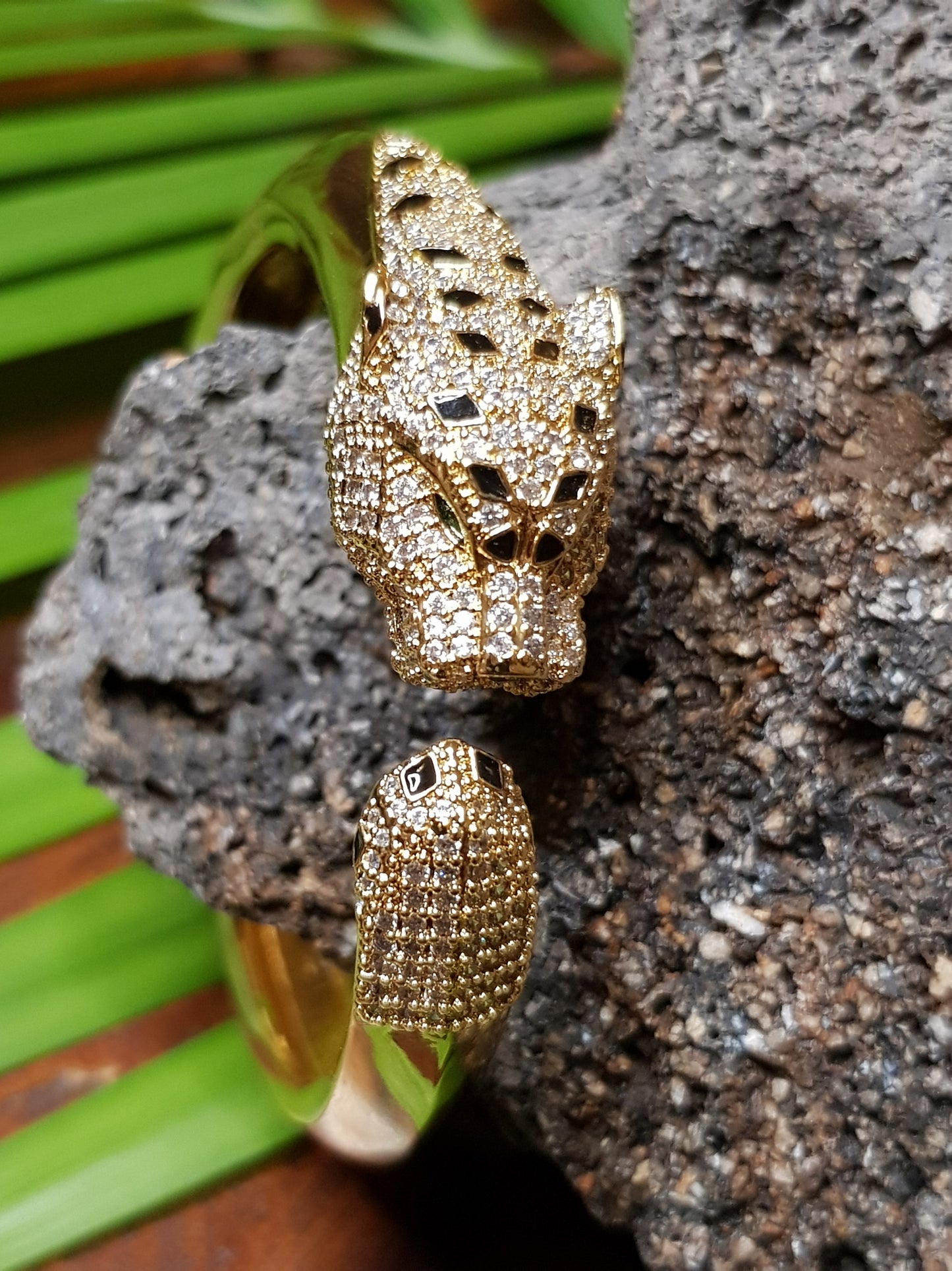 Lion head gold finish bracelet, black stones and CZ detailing