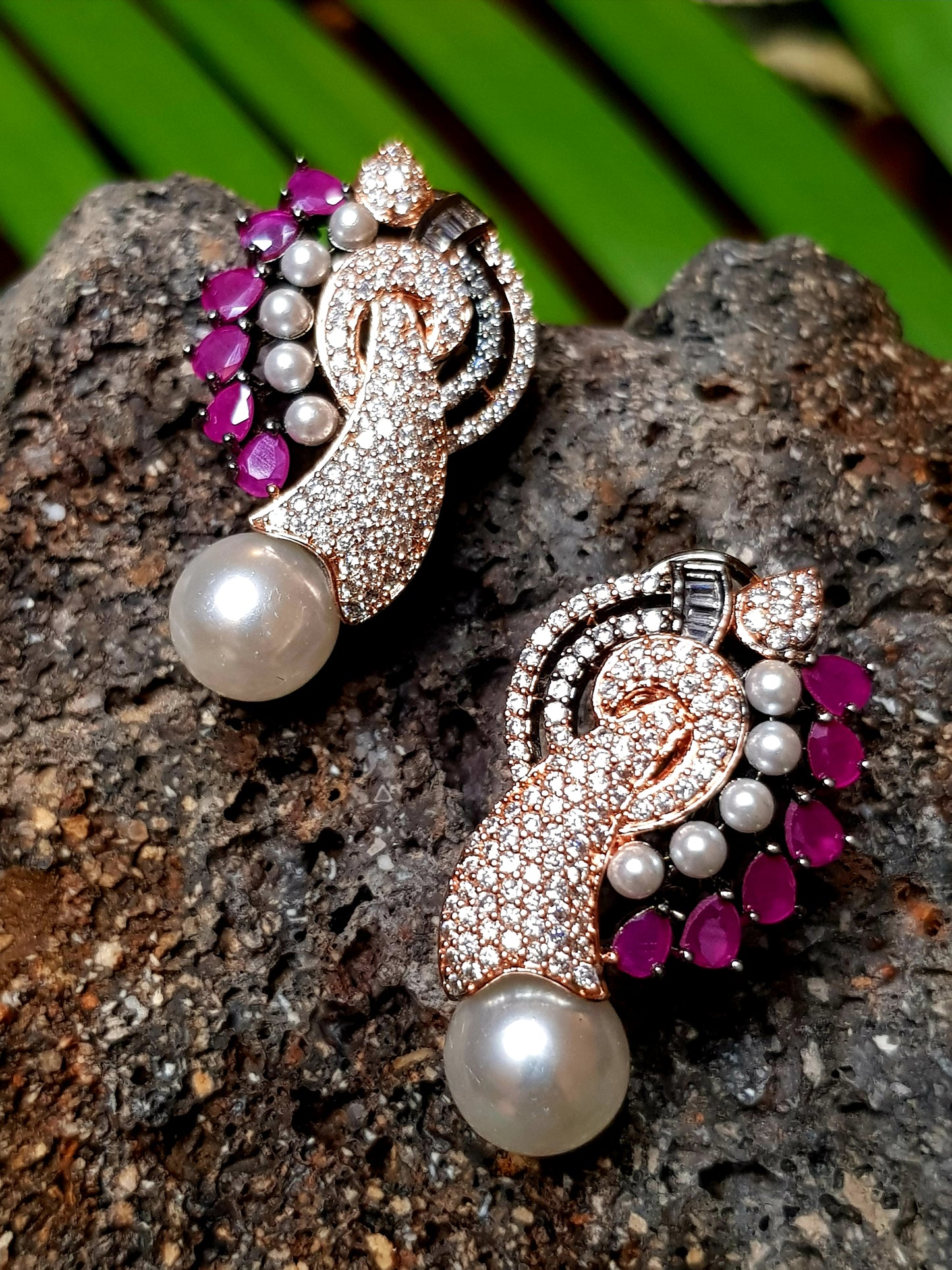 Gorgeous pendant set in antique finish, mayur influence with red stone, pearls and CZ, matching earrings