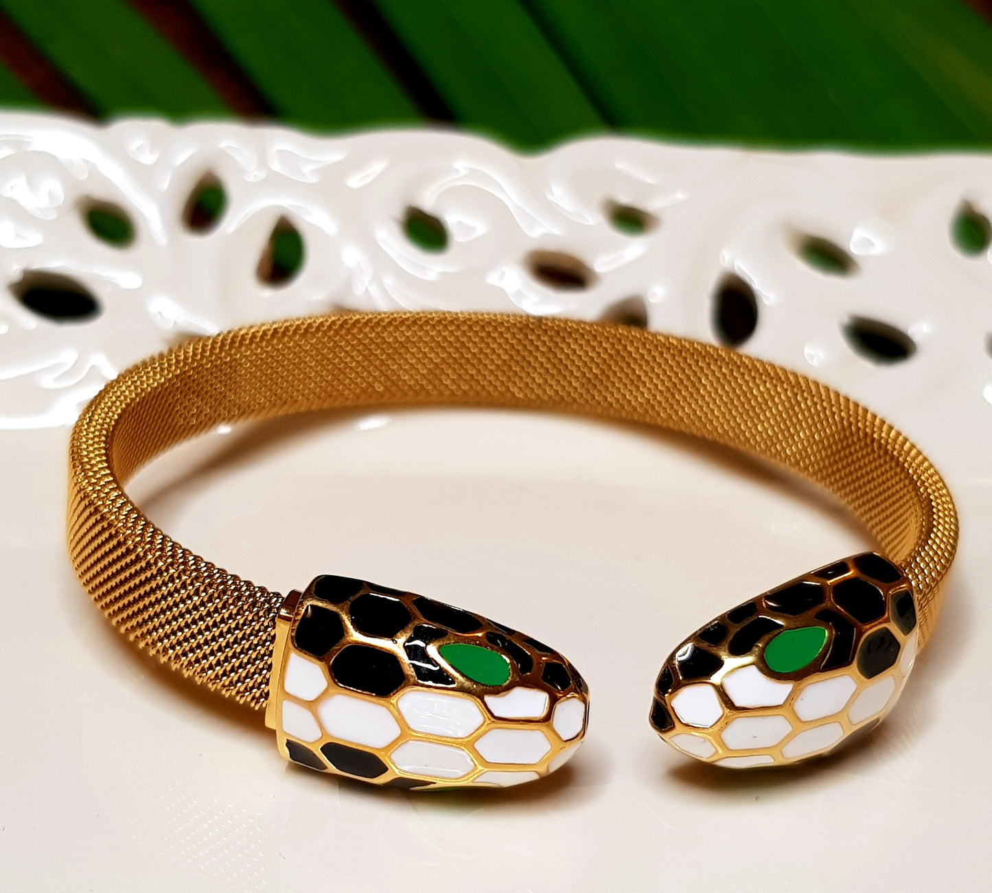 Smart snake head gold finish bracelet, white, black, green meenakari detailing