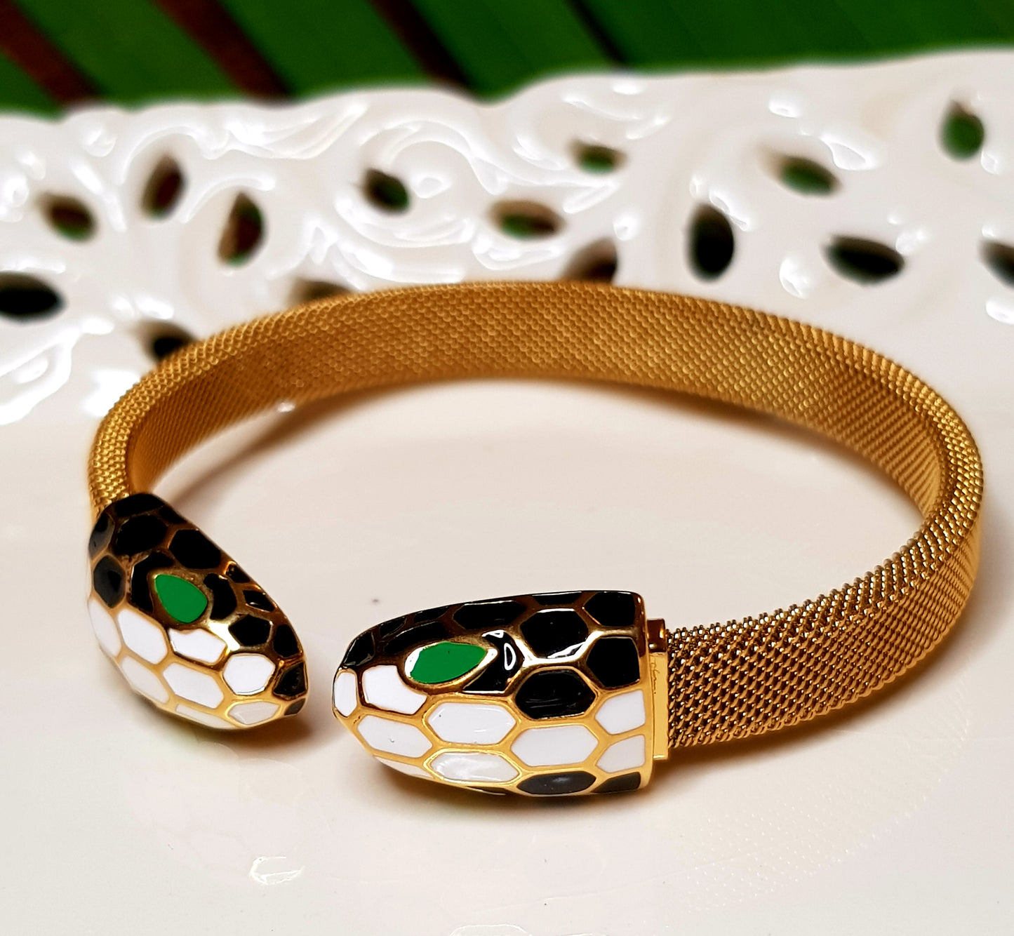 Smart snake head gold finish bracelet, white, black, green meenakari detailing