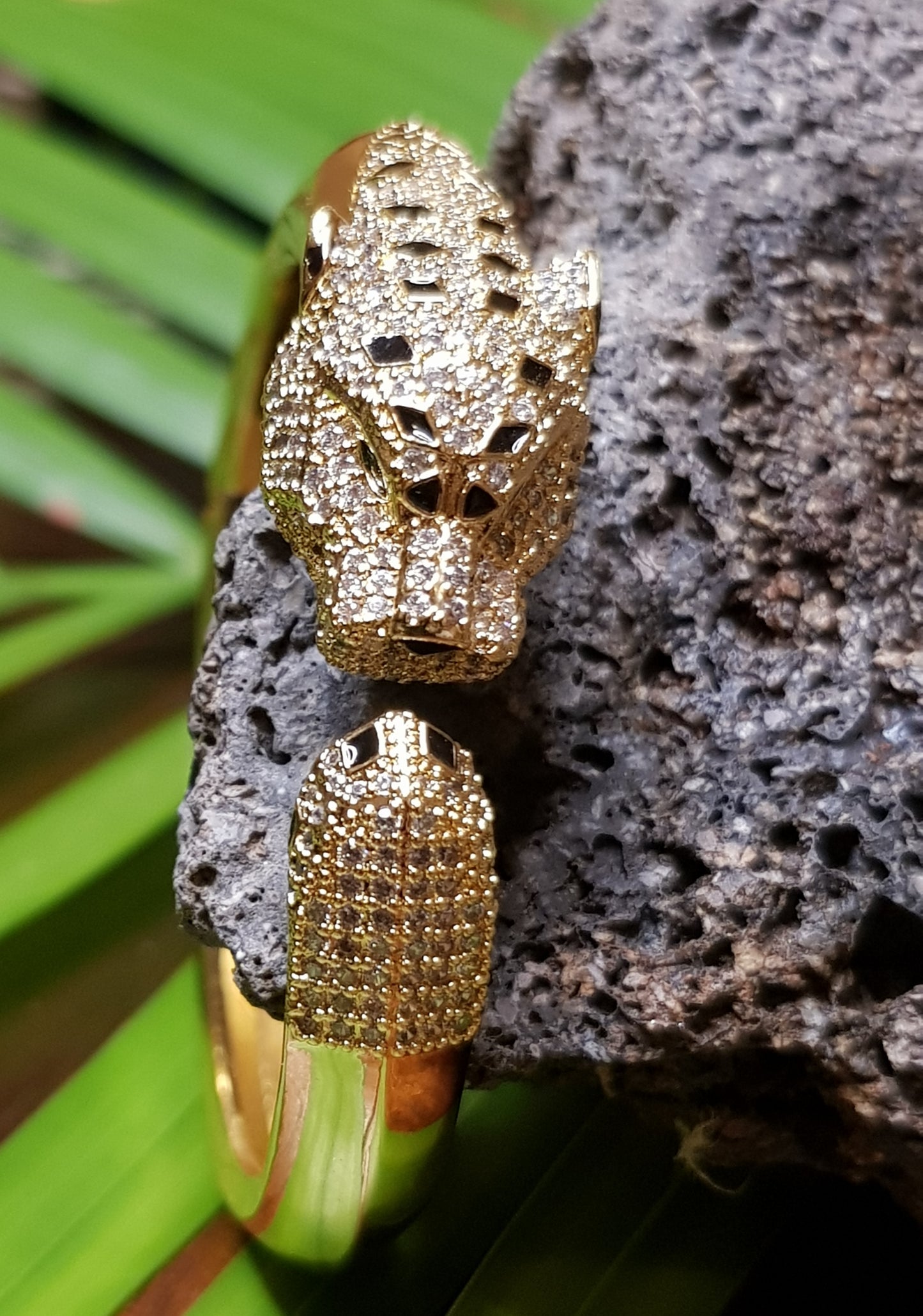 Lion head gold finish bracelet, black stones and CZ detailing