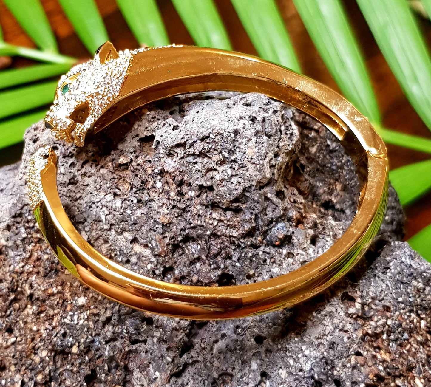 Lion head gold finish bracelet, black stones and CZ detailing