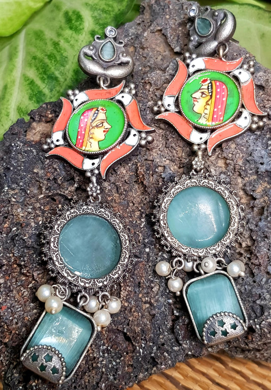 Silver finish,with hand painted Indian lady in the middle of long earrings