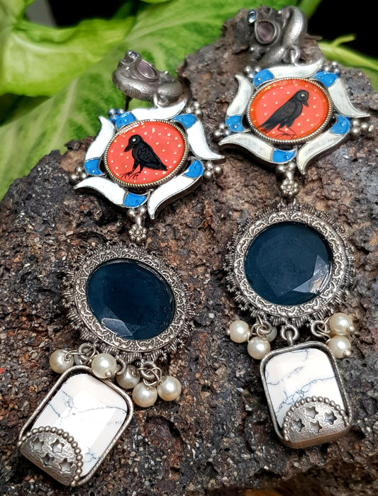 Silver finish,hand painted crow earrings in an interesting pattern