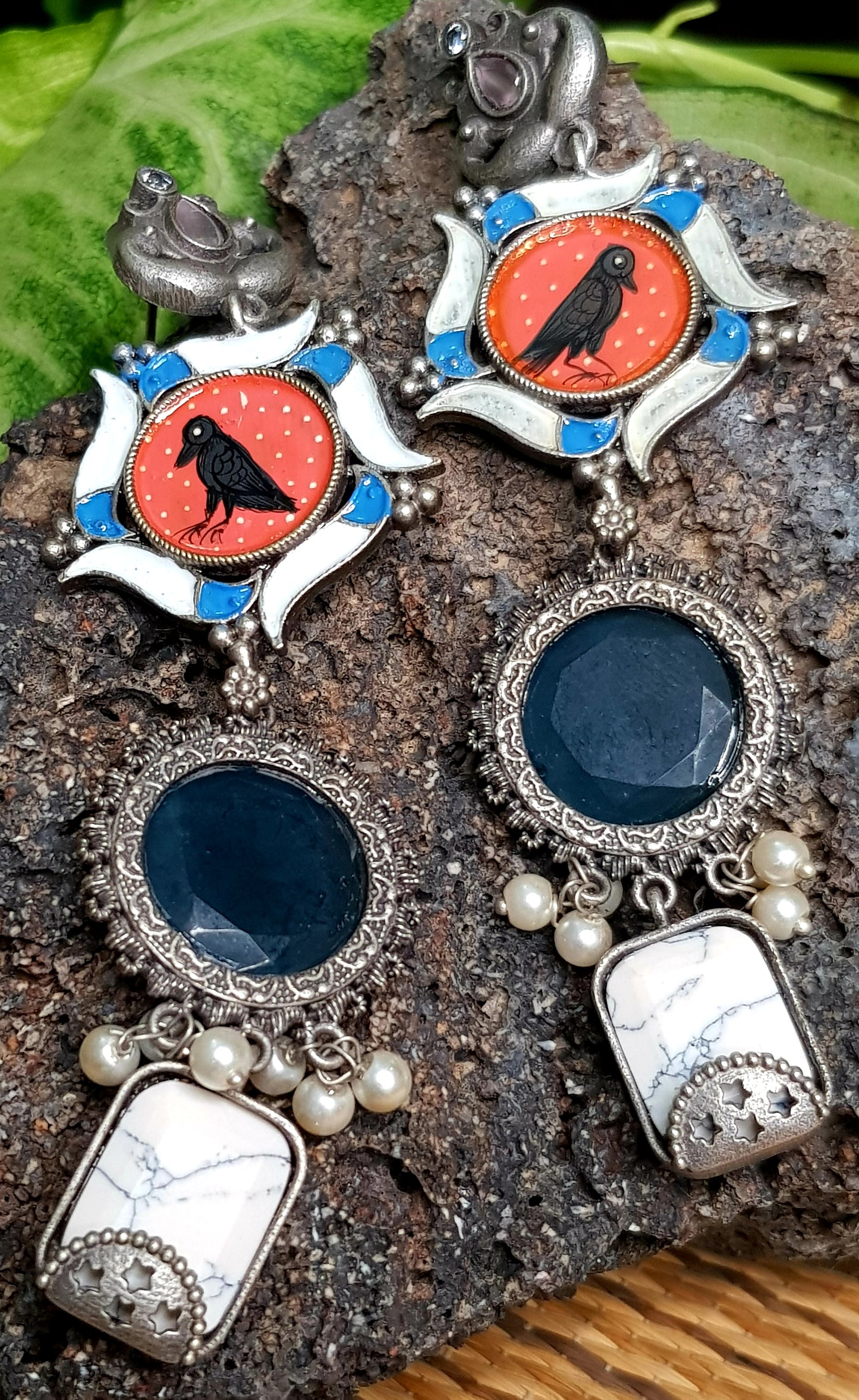 Silver finish,hand painted crow earrings in an interesting pattern