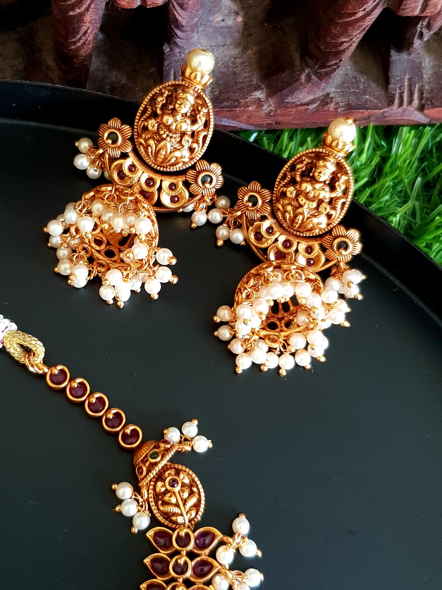 Temple jewelry set, necklace with Goddess Lakshmi motif and red stones detailing, matching jhumkas (earrings)