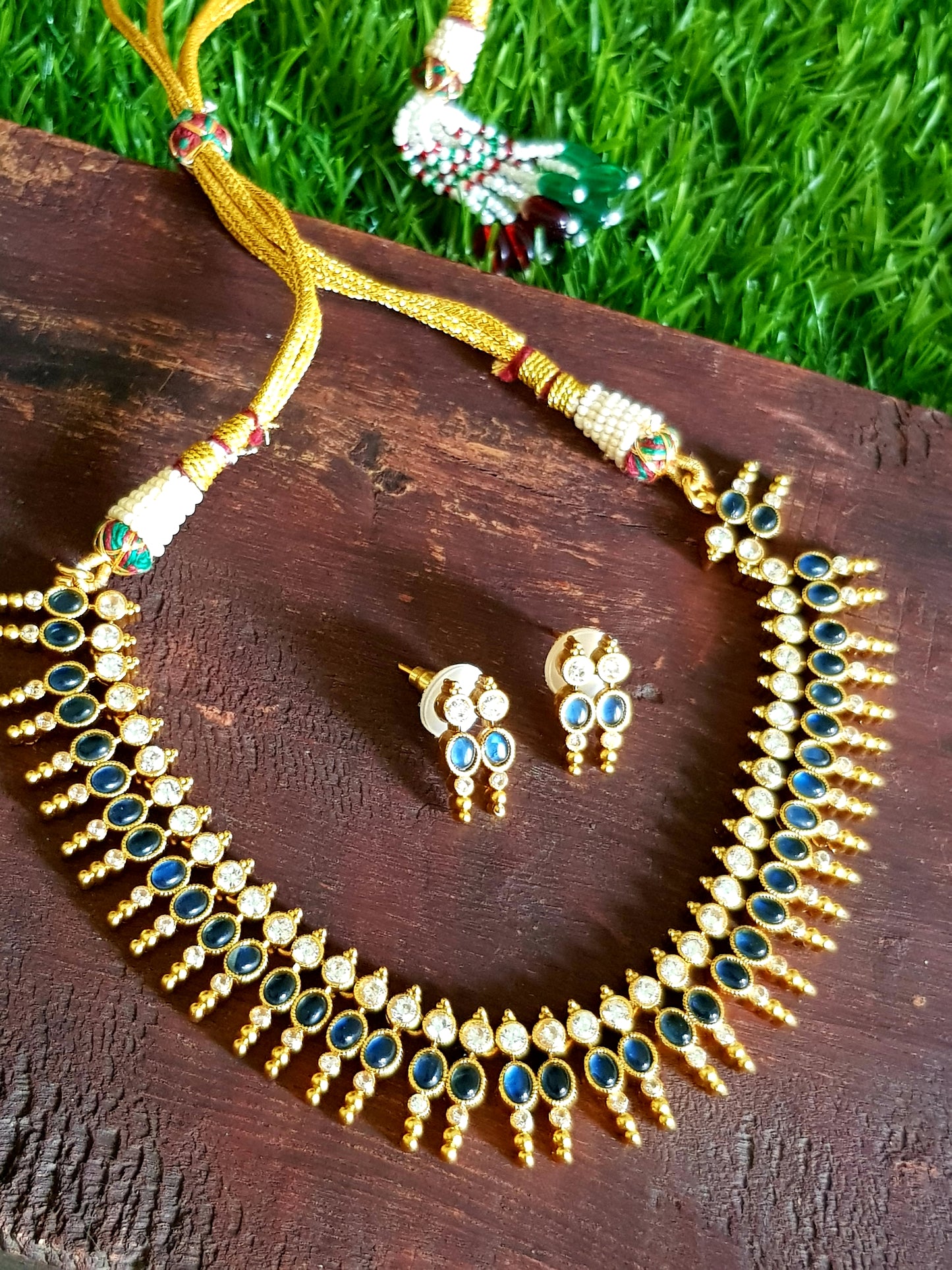 Gold finish set, sapphire and clear stone Kemp inlay with golden bead design, matching studs (earrings)