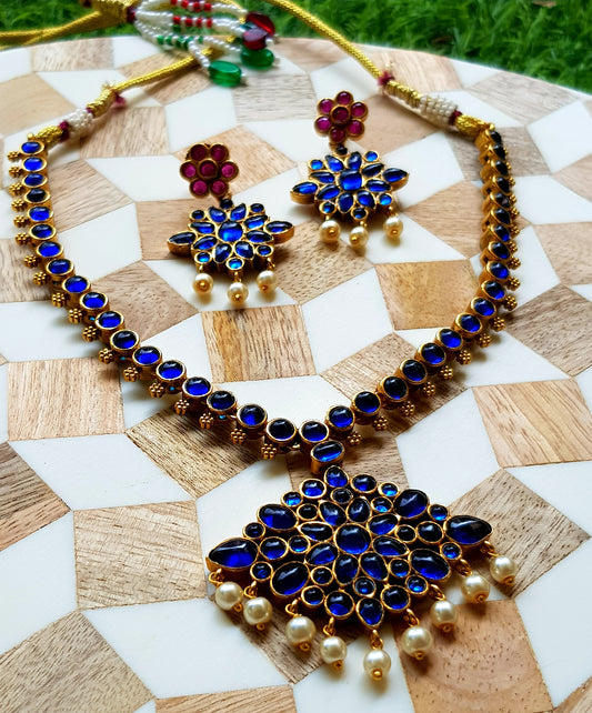 Reversible kemp set, in blue sapphire/ruby-navratan stone inlay with pearl hangings, reversible matching earrings