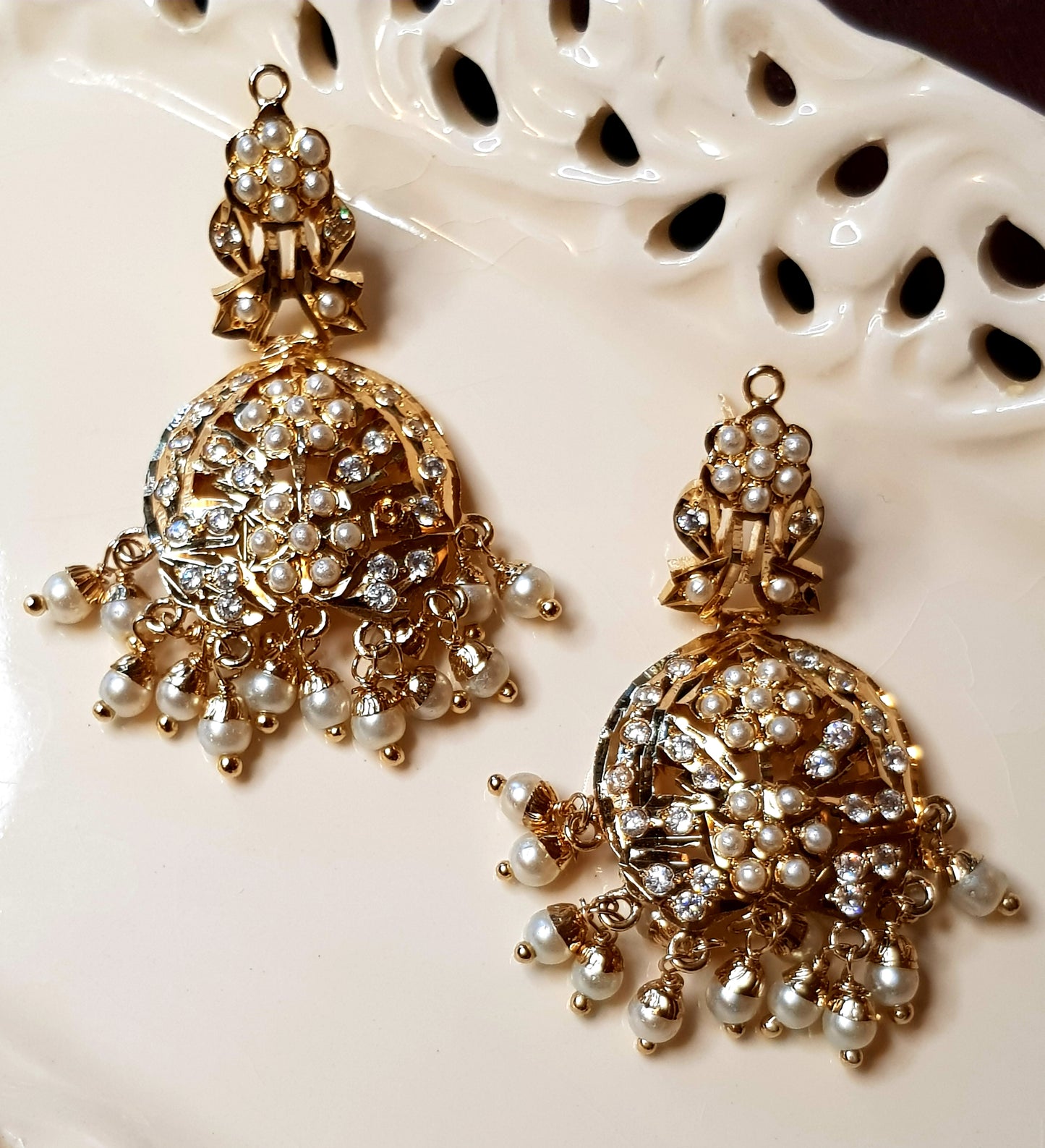 Jadau set in pearls with a hanging pendant, triple pearl strands, in choker style and matching  earrings