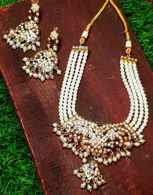 Jadau set in pearls with a hanging pendant, triple pearl strands, in choker style and matching  earrings