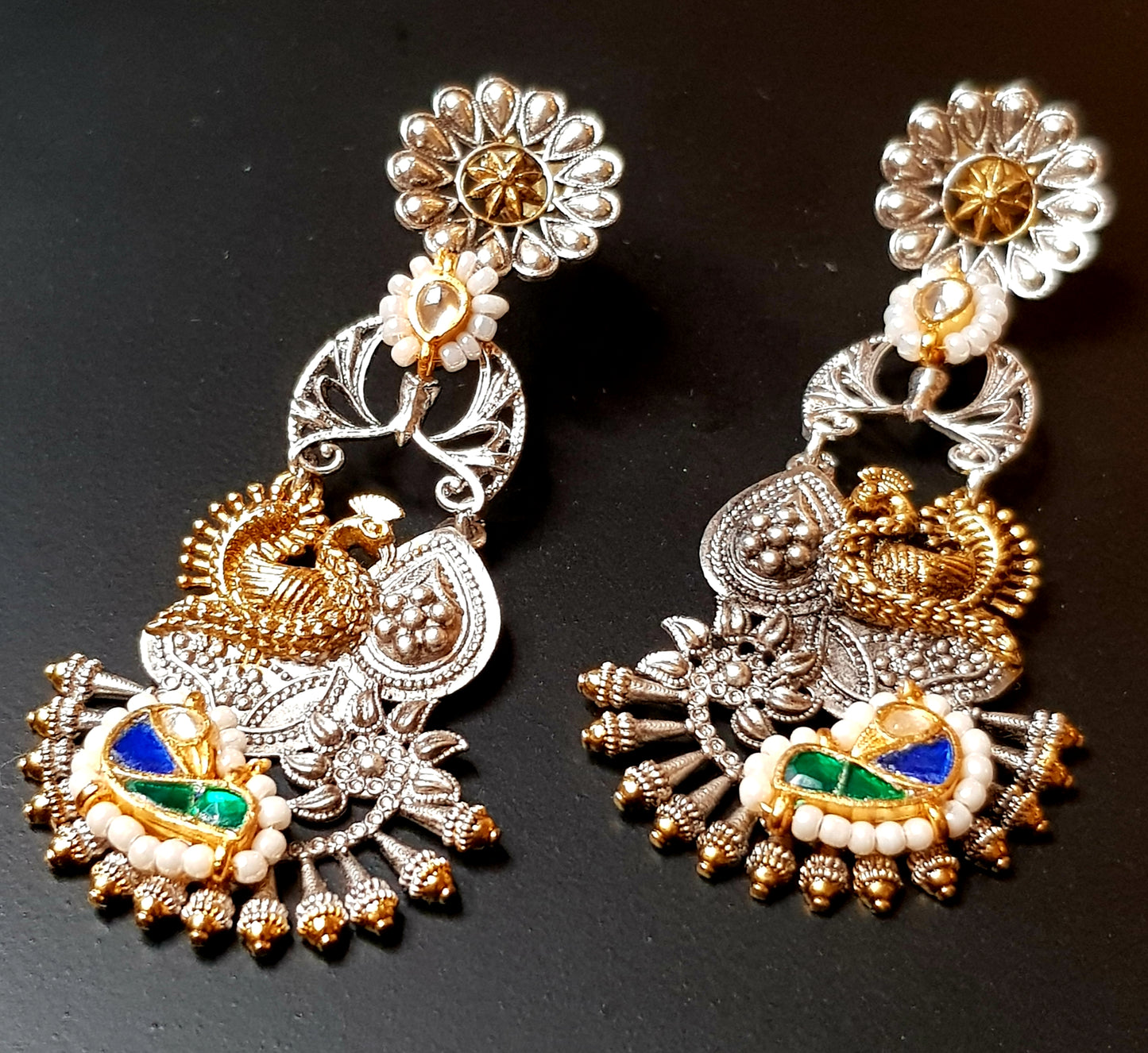 Dual tone green-blue/green-pink intricate work peacock meenakari long earrings