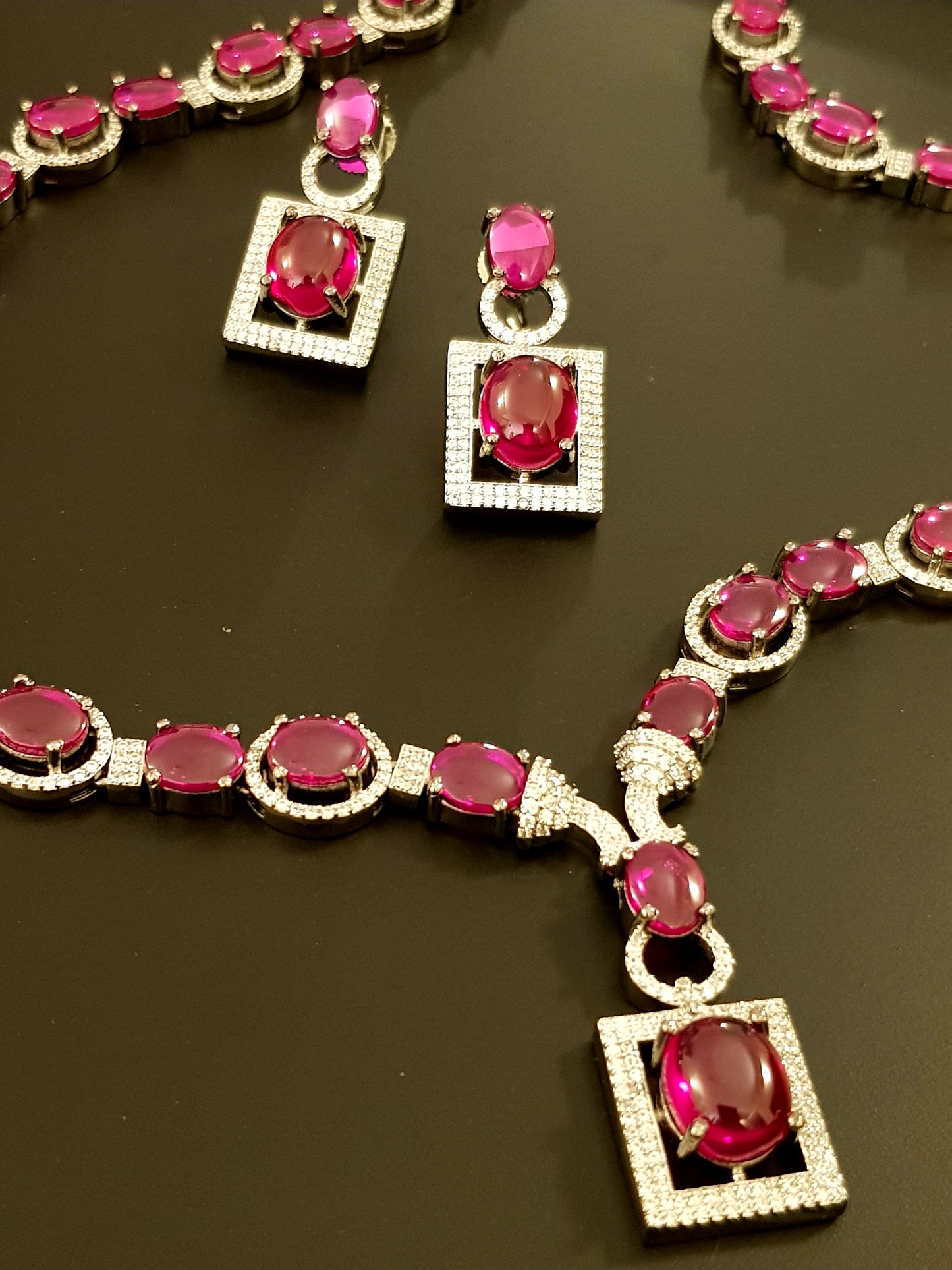 Platinum finish ruby stone and CZ set, long necklace and matching earrings