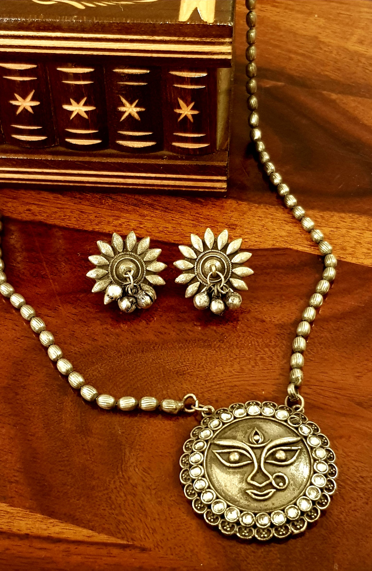 Durga motif necklace and earrings silver finish set with neutral/green and deep pink stone inlay