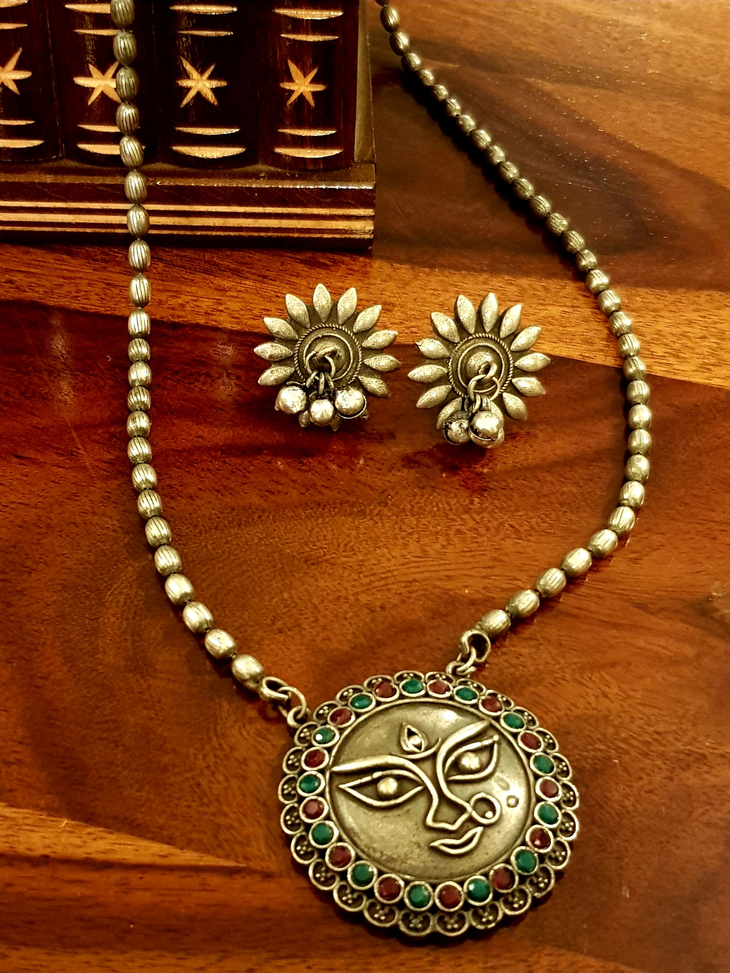 Durga motif necklace and earrings silver finish set with neutral/green and deep pink stone inlay