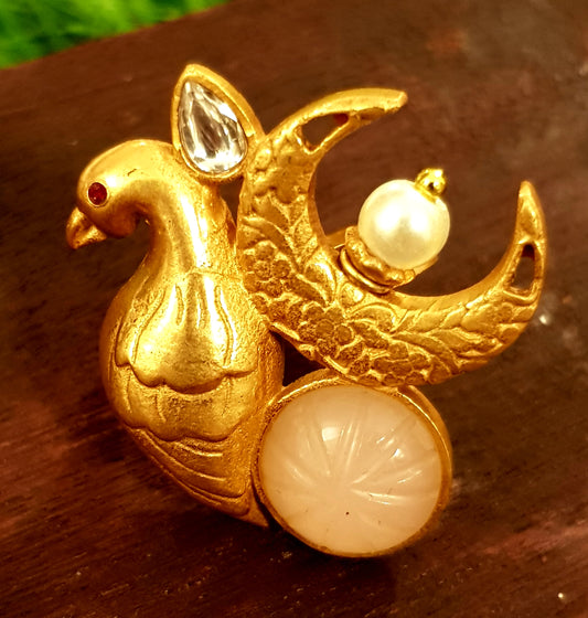 Gold finish bird motif ring with pale pink stone, kundan and pearl