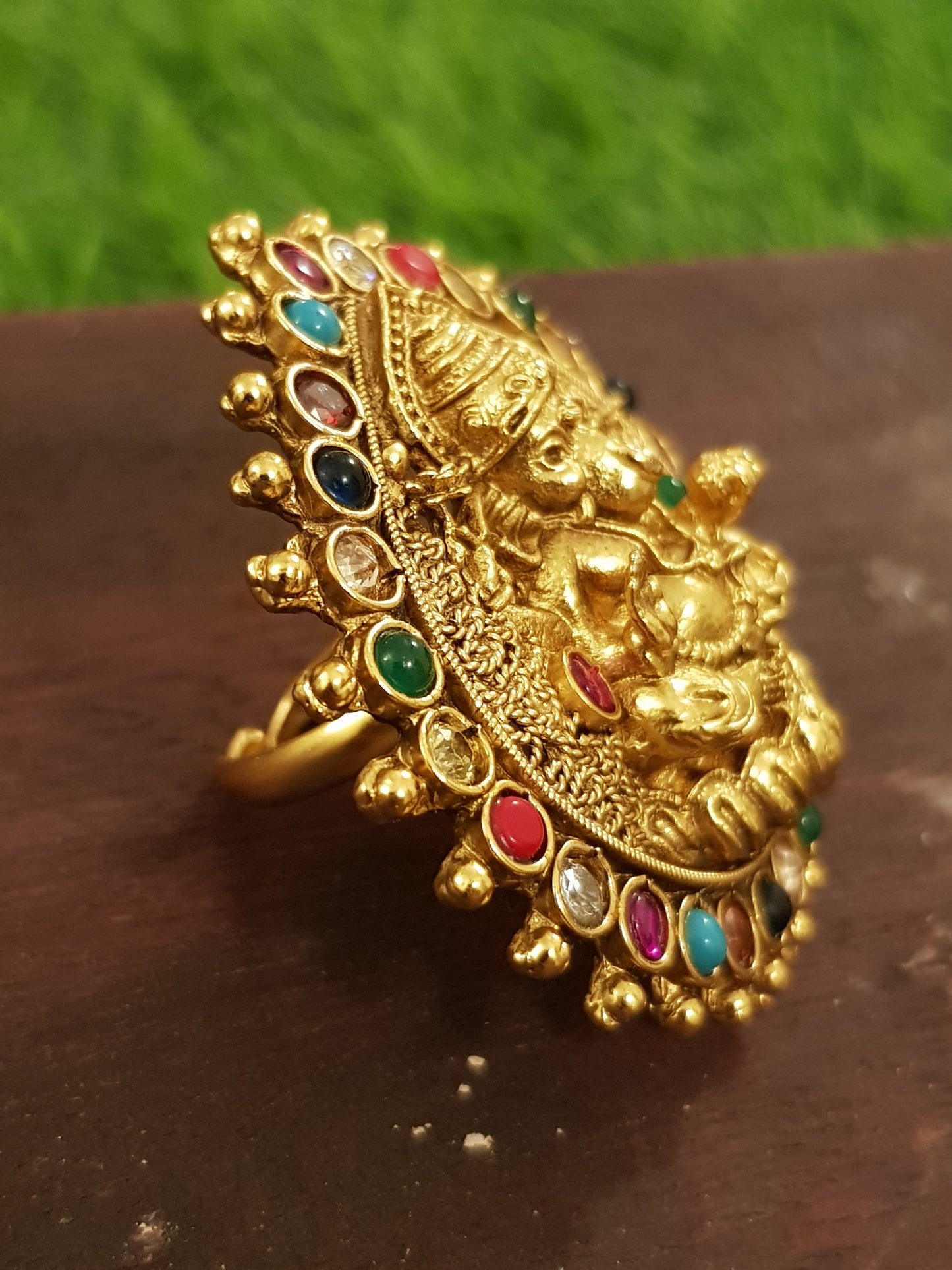 Temple jewelry ring with lord Ganesha motif and navratan stones