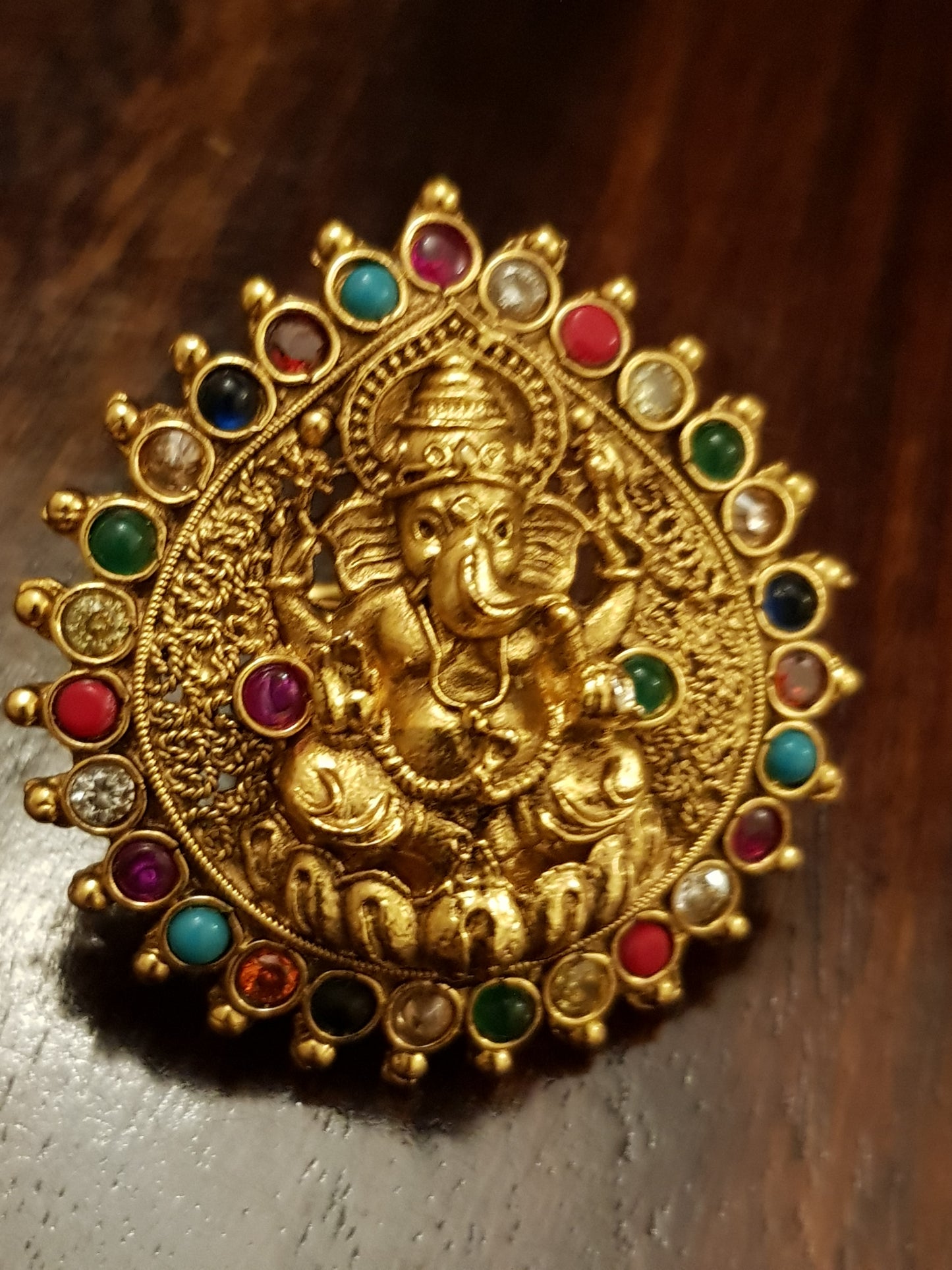 Temple jewelry ring with lord Ganesha motif and navratan stones