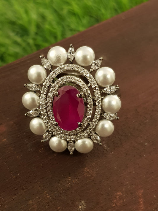 A victorian antique silver finish ring with ruby/emerald colour stone, pearl and CZ detailing