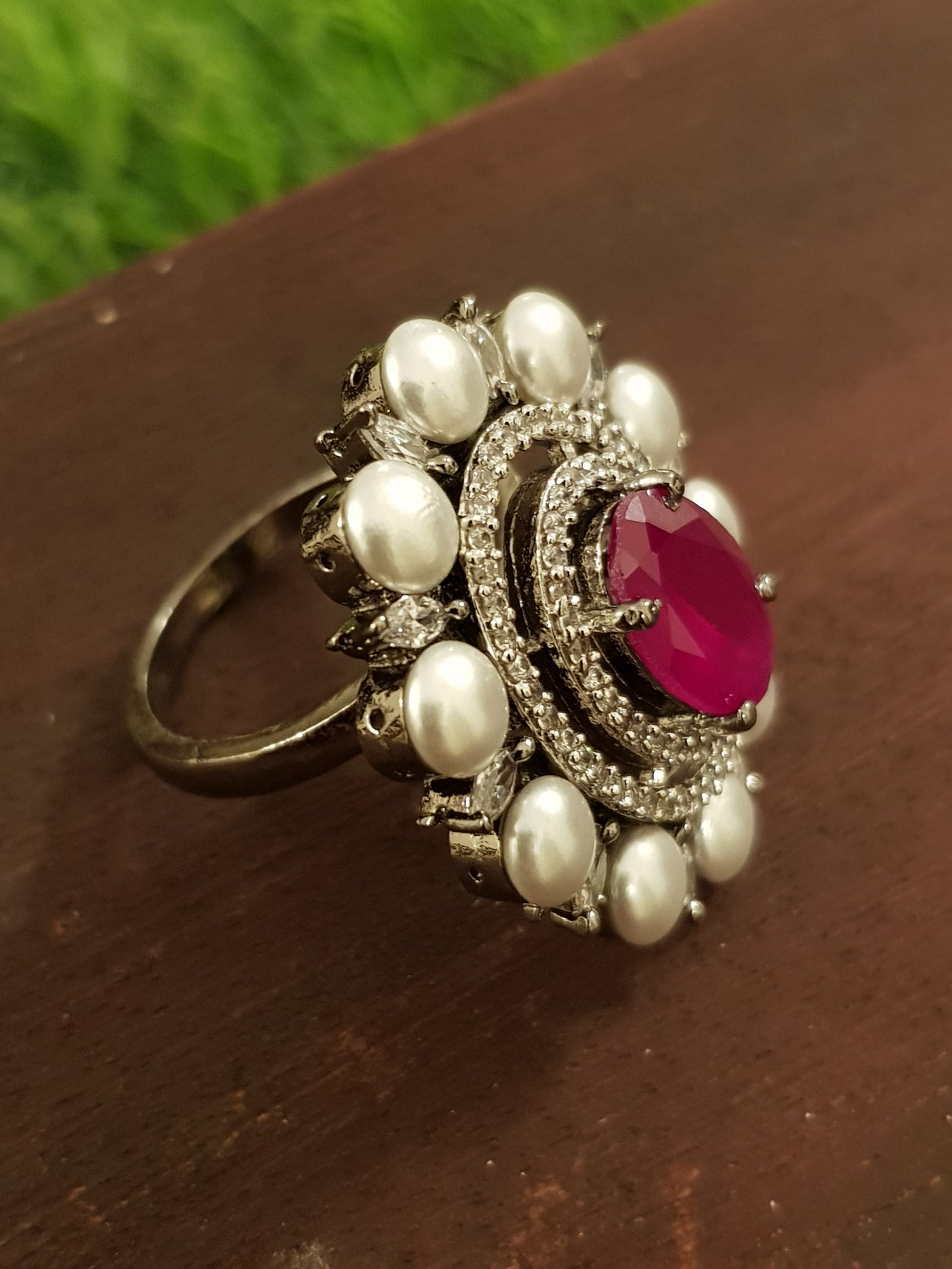 A victorian antique silver finish ring with ruby/emerald colour stone, pearl and CZ detailing