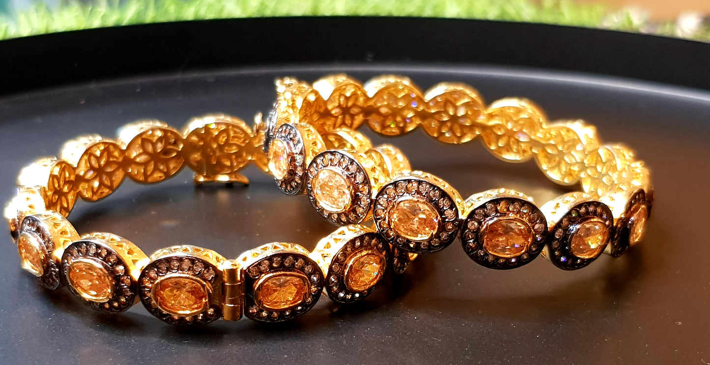 Gold finish bangle with oval topaz stones surrounded by CZ (2 pc) size-2.6