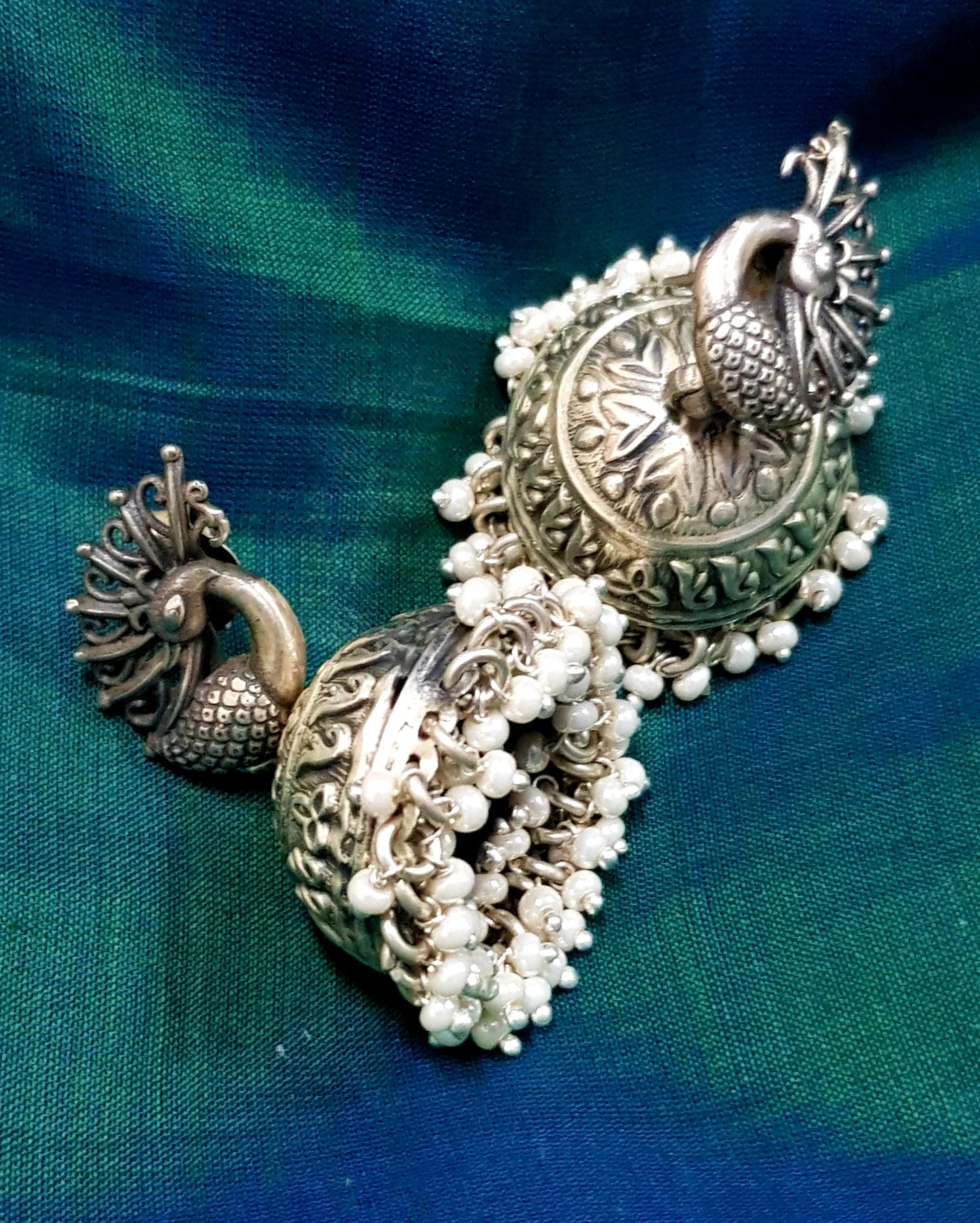 Silver peacock earrings (jhumkas) with pearls