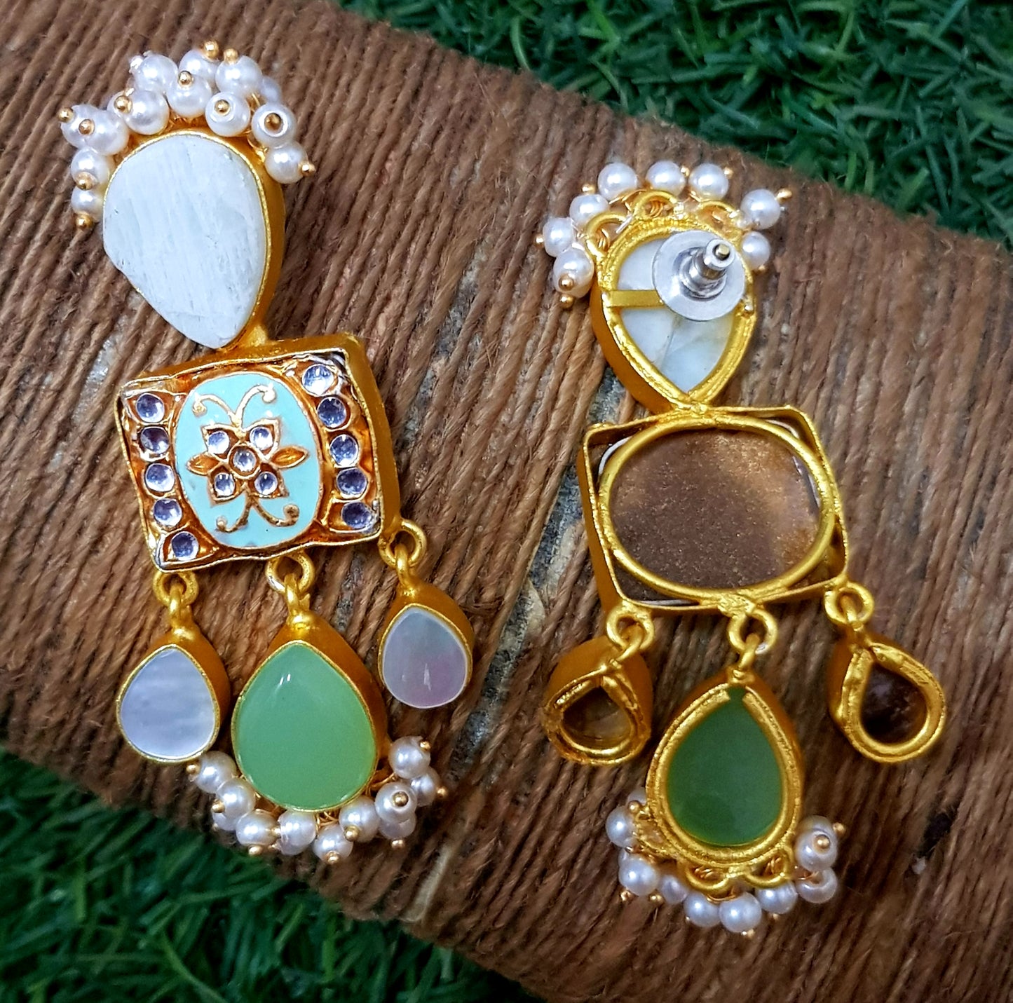 Gold finish earrings with meenakari,mother of pearl and pale green stone drops