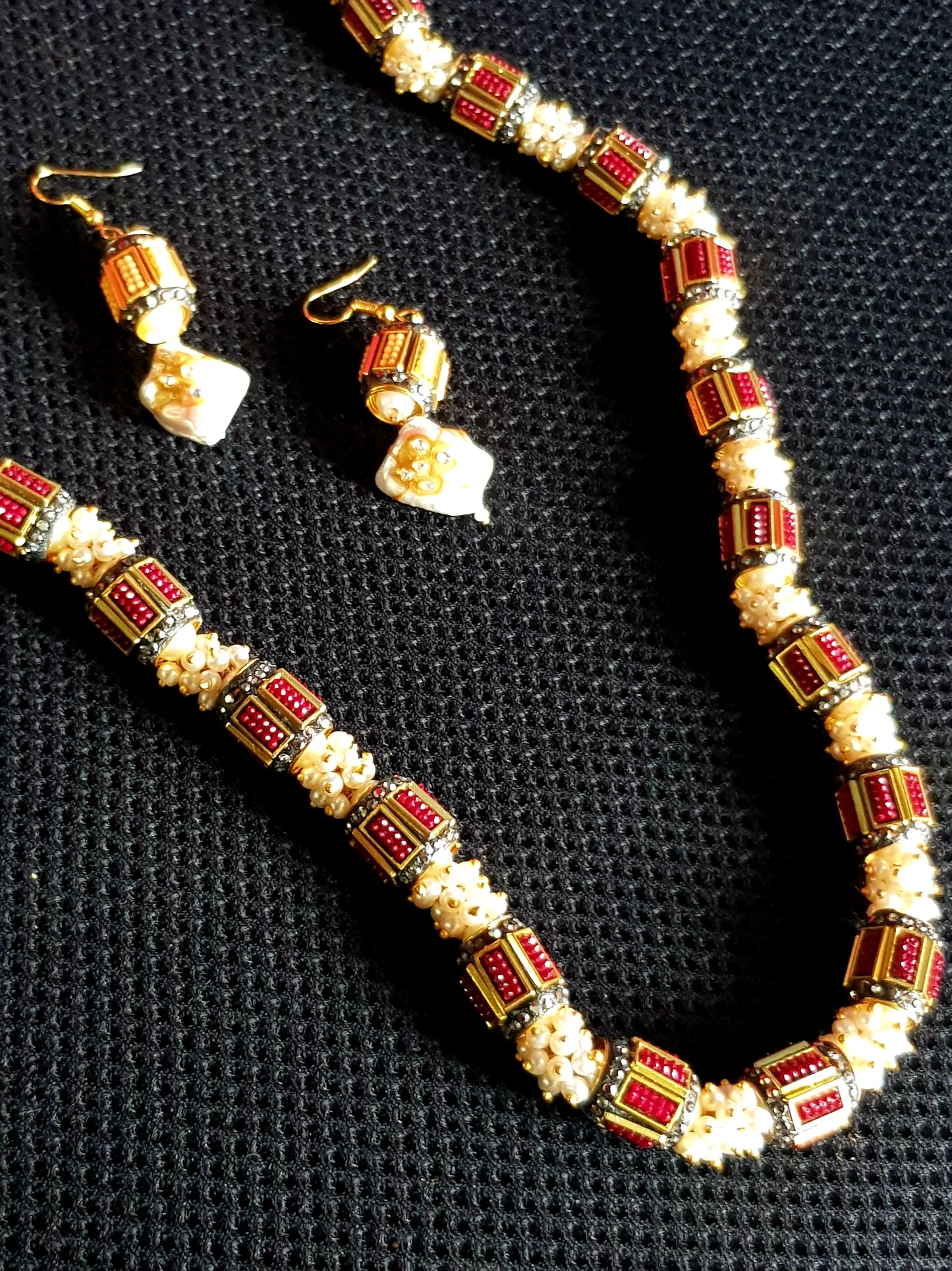 Set with metal beads with work in maroon/grey interspaced with pearl clusters, matching earring