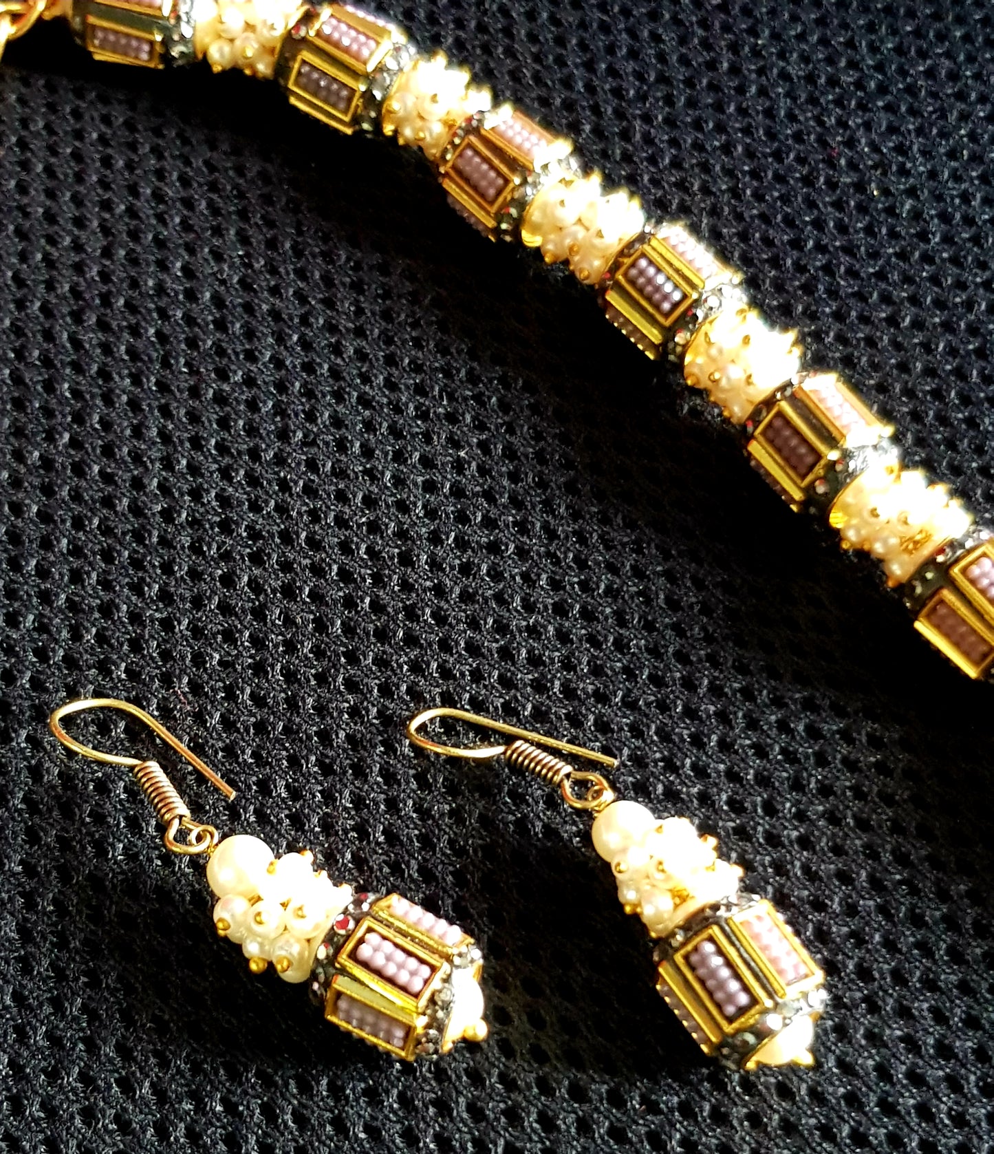 Set with metal beads with work in maroon/grey interspaced with pearl clusters, matching earring