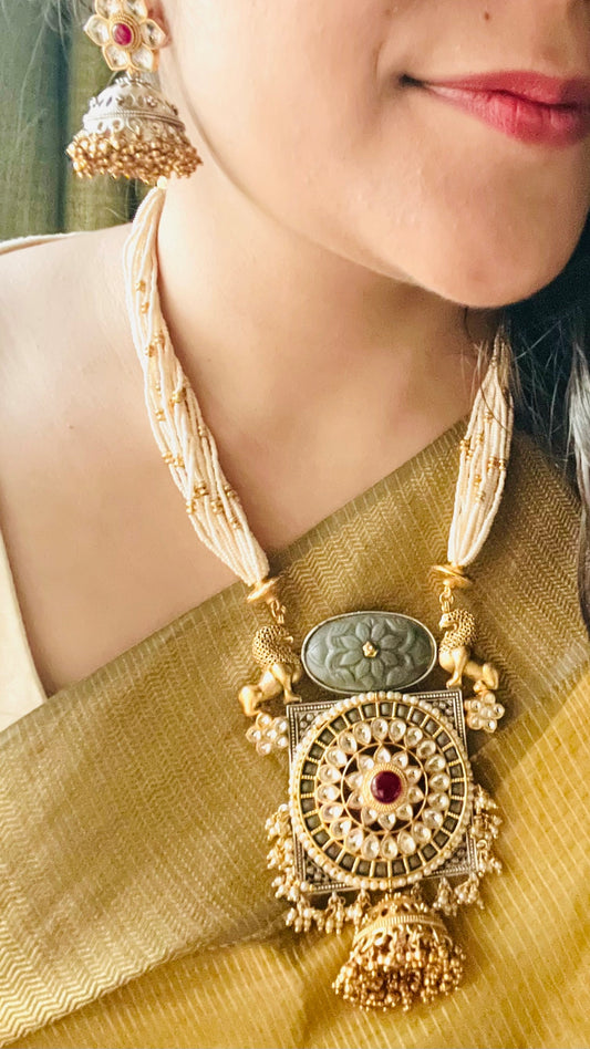 Gold finish lion motif set with multilayer pearl necklace, matching jhumka (earrings)