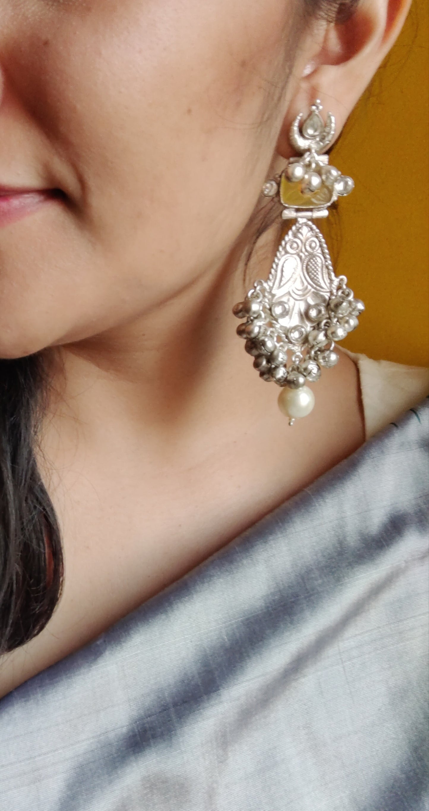 Silver finish earrings with yellow stone ,kundan and pearls