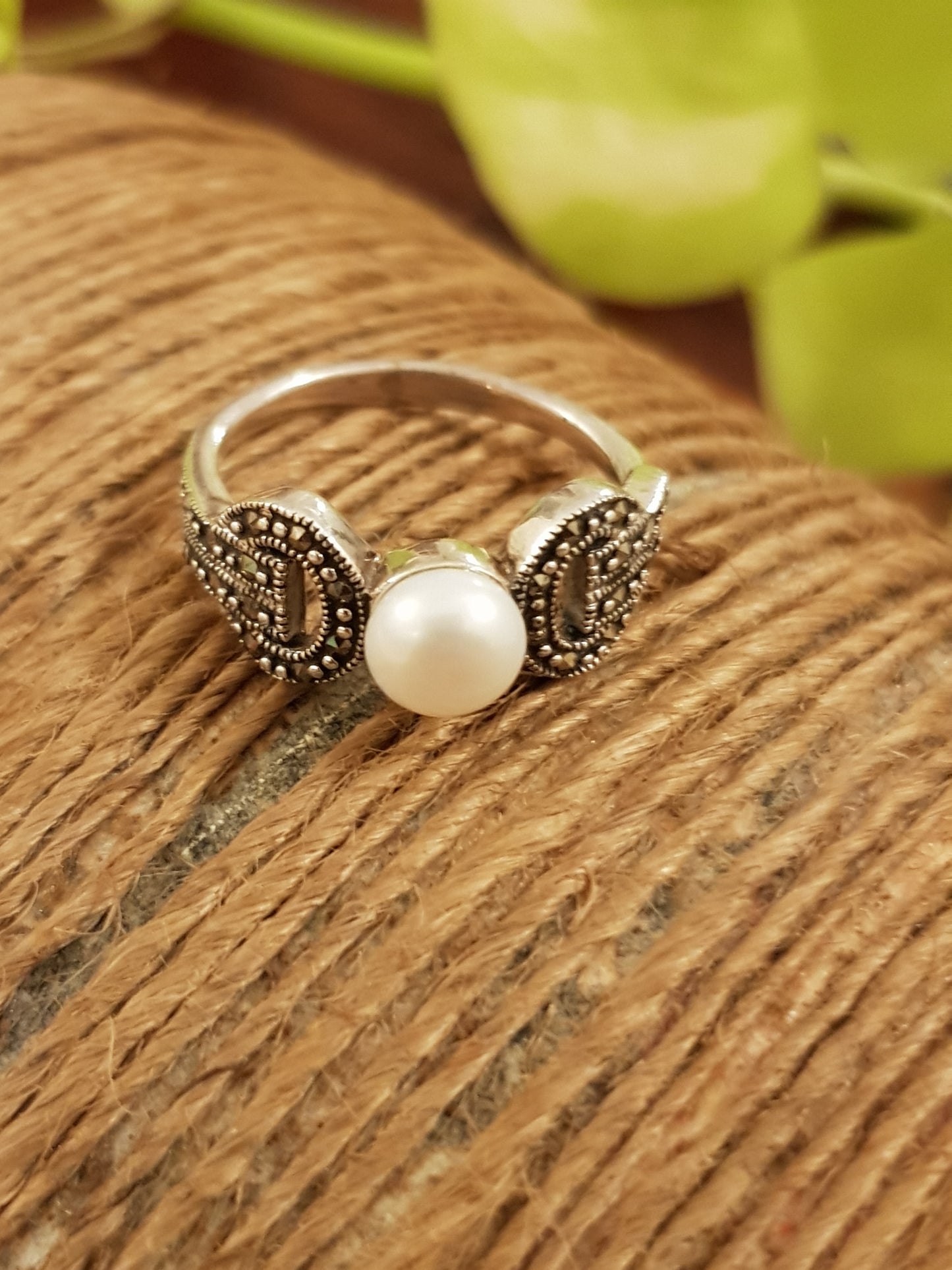 Silver ring with marcasite and a single pearl in centre