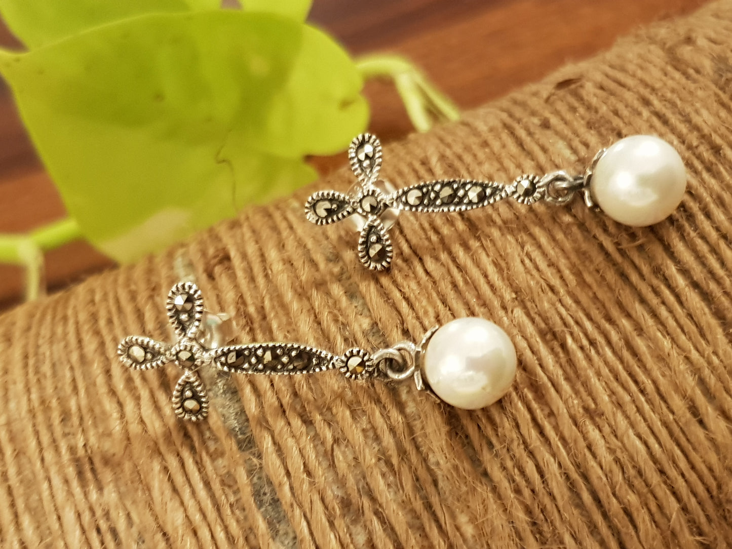 Silver earrings, hanging pearl on flower shaped marcasite stud