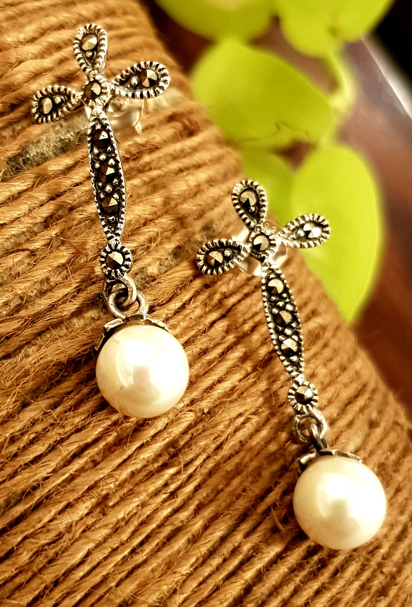 Silver earrings, hanging pearl on flower shaped marcasite stud