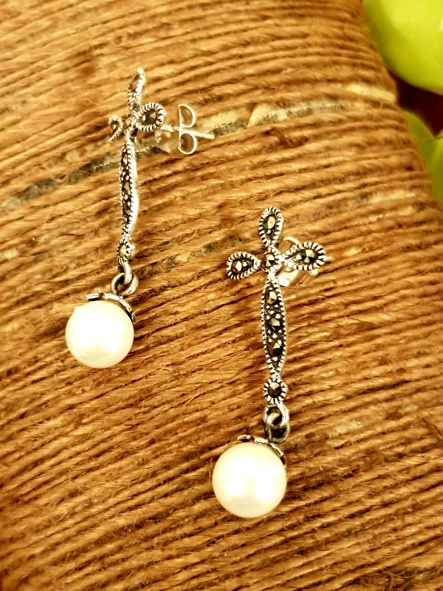 Silver earrings, hanging pearl on flower shaped marcasite stud