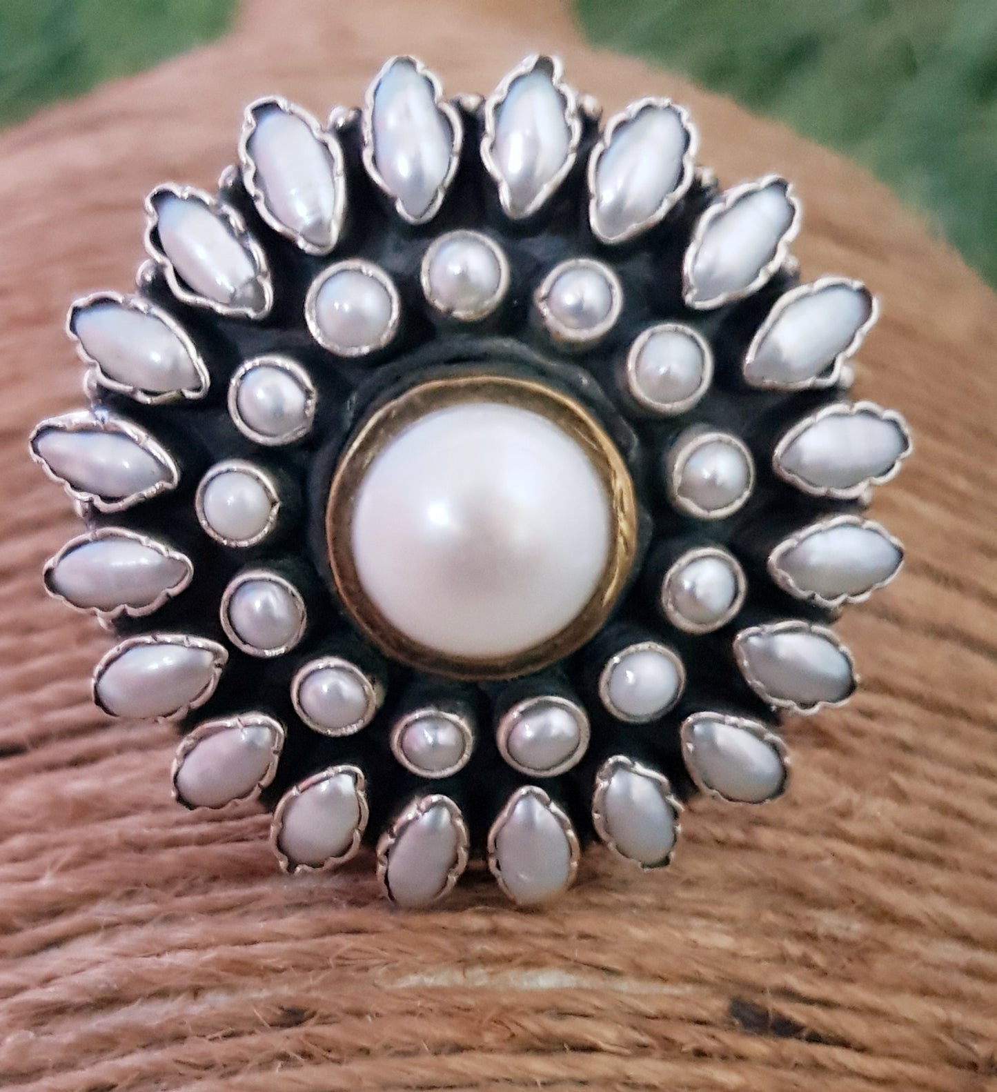 Silver ring with pearls in a flower shaped design