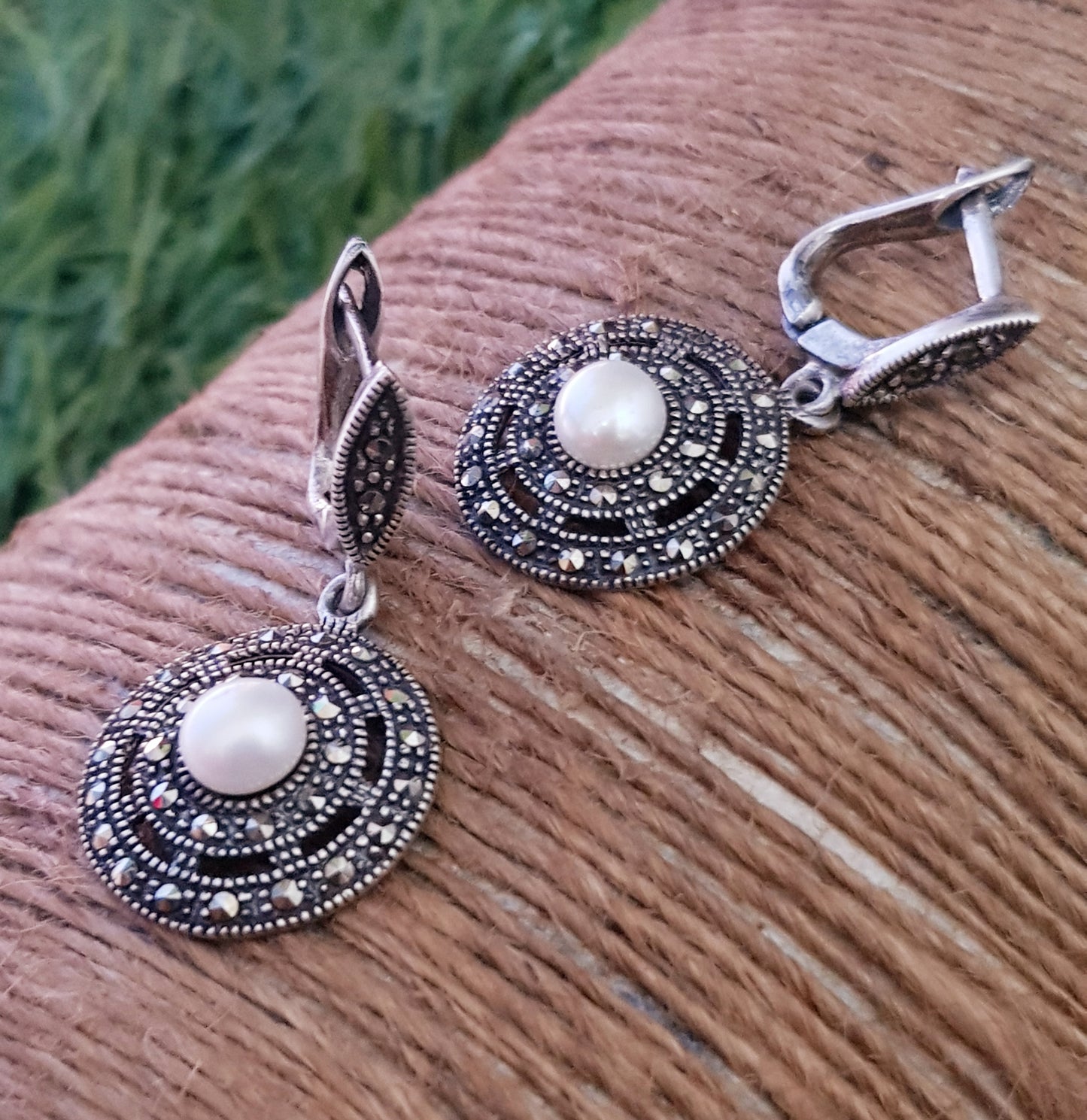 Silver hanging earrings, concentric circles with marcasite with pearl in center