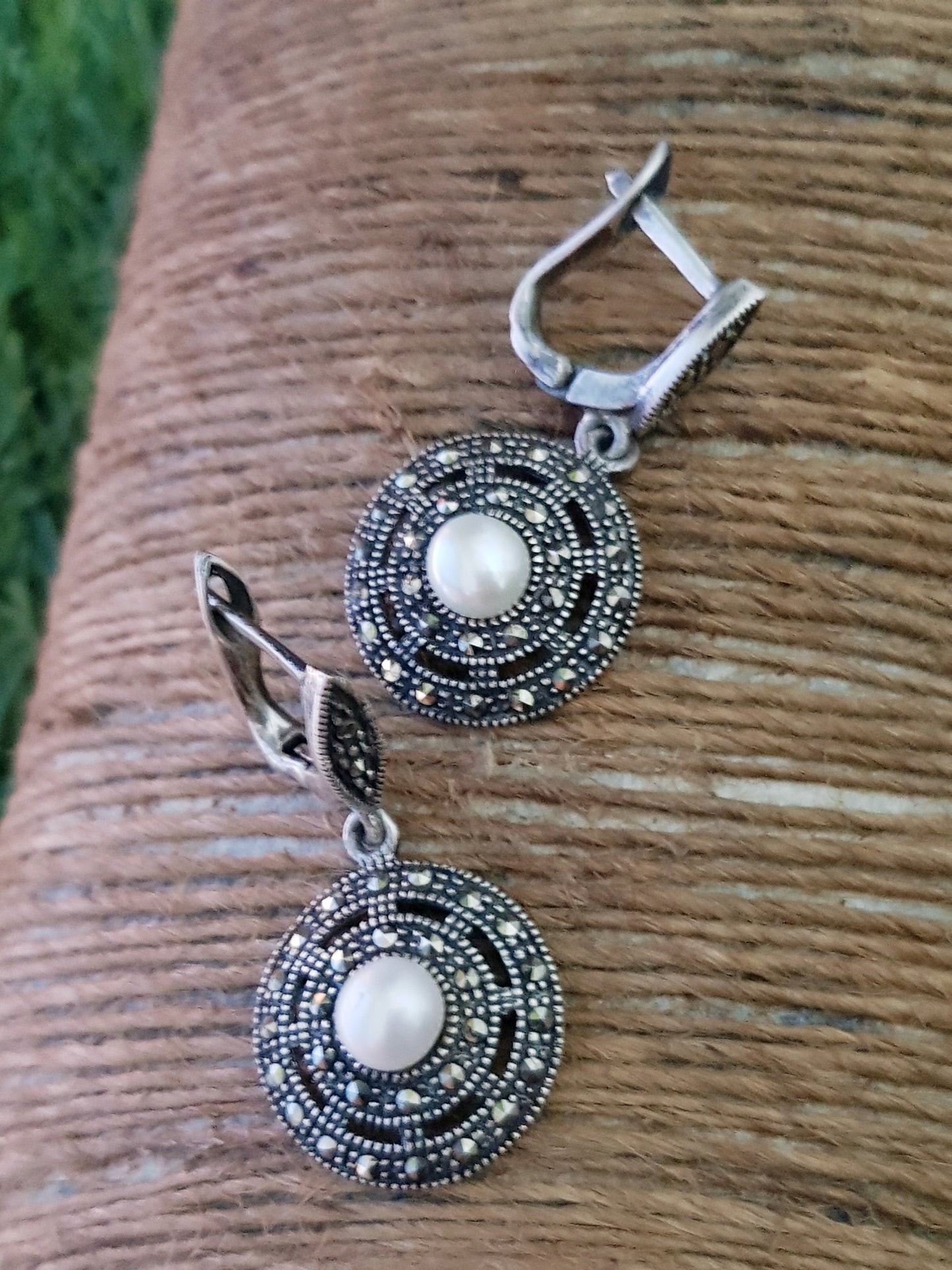 Silver hanging earrings, concentric circles with marcasite with pearl in center