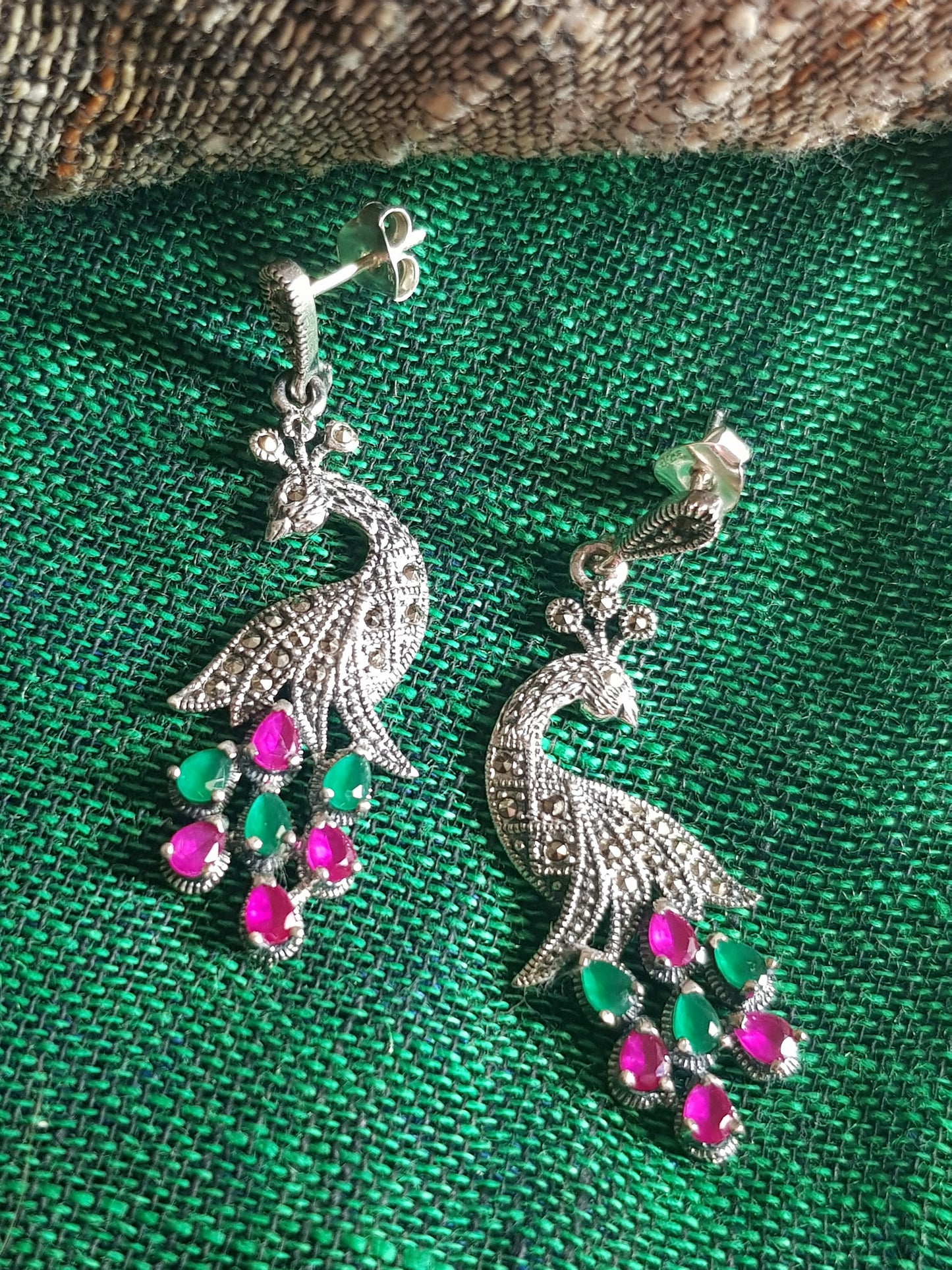 Silver peacock earrings, intricate carving with ruby/emerald-ruby stone variants