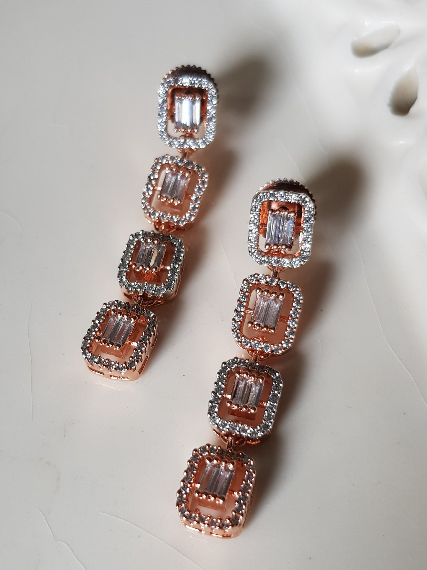 Rose gold/antique white and rose gold finish set in rectangular pattern CZ setting, matching danglers (earrings)